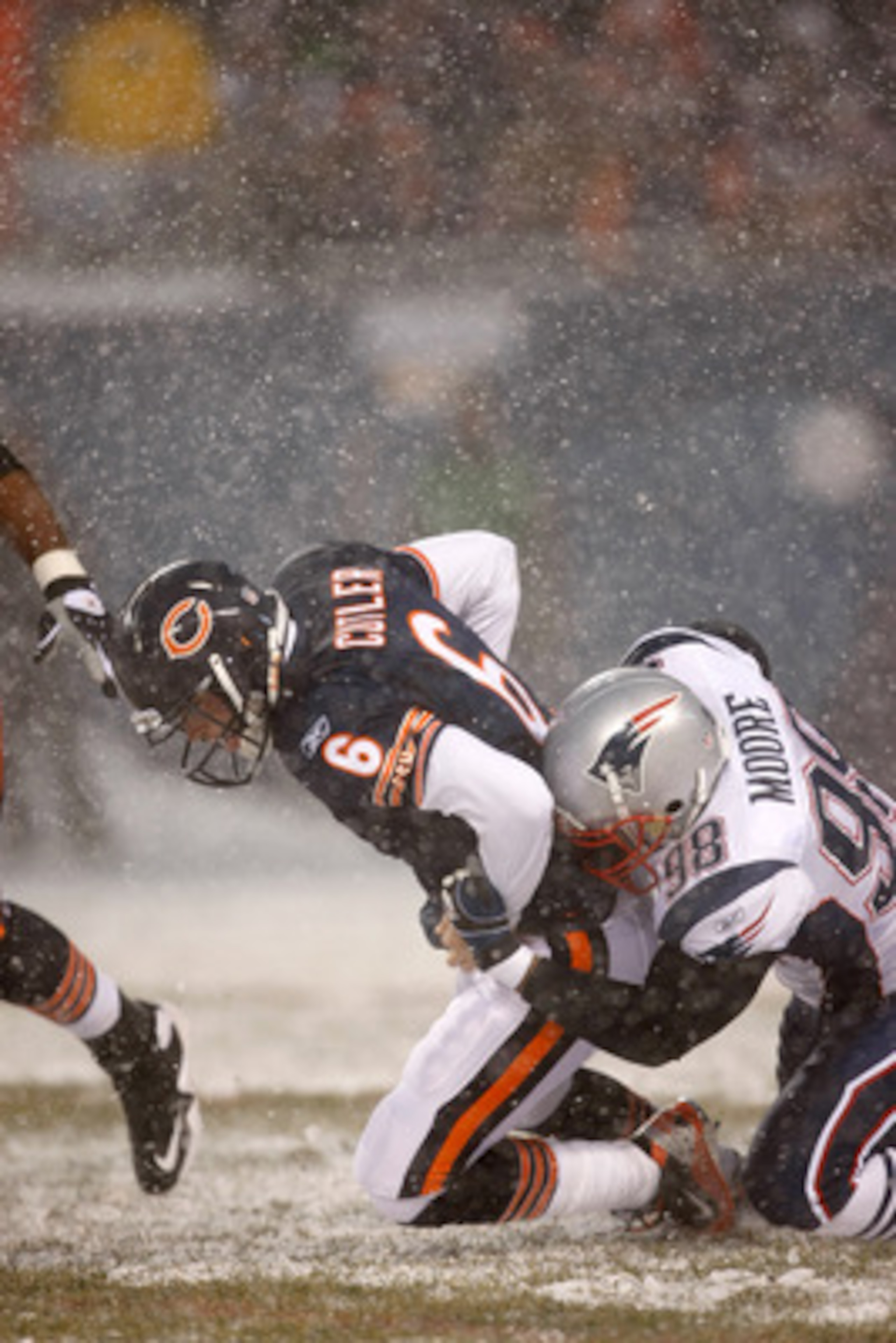 CHICAGO, IL - DECEMBER 12: Eric Moore #98 of the New England Patriots sacks quarterback Jay Cutler #6 of the Chicago Bears at Soldier Field on December 12, 2010 in Chicago, Illinois. The Patriots defeated the Bears 36-7. (Photo by Scott Boehm/Getty Images
