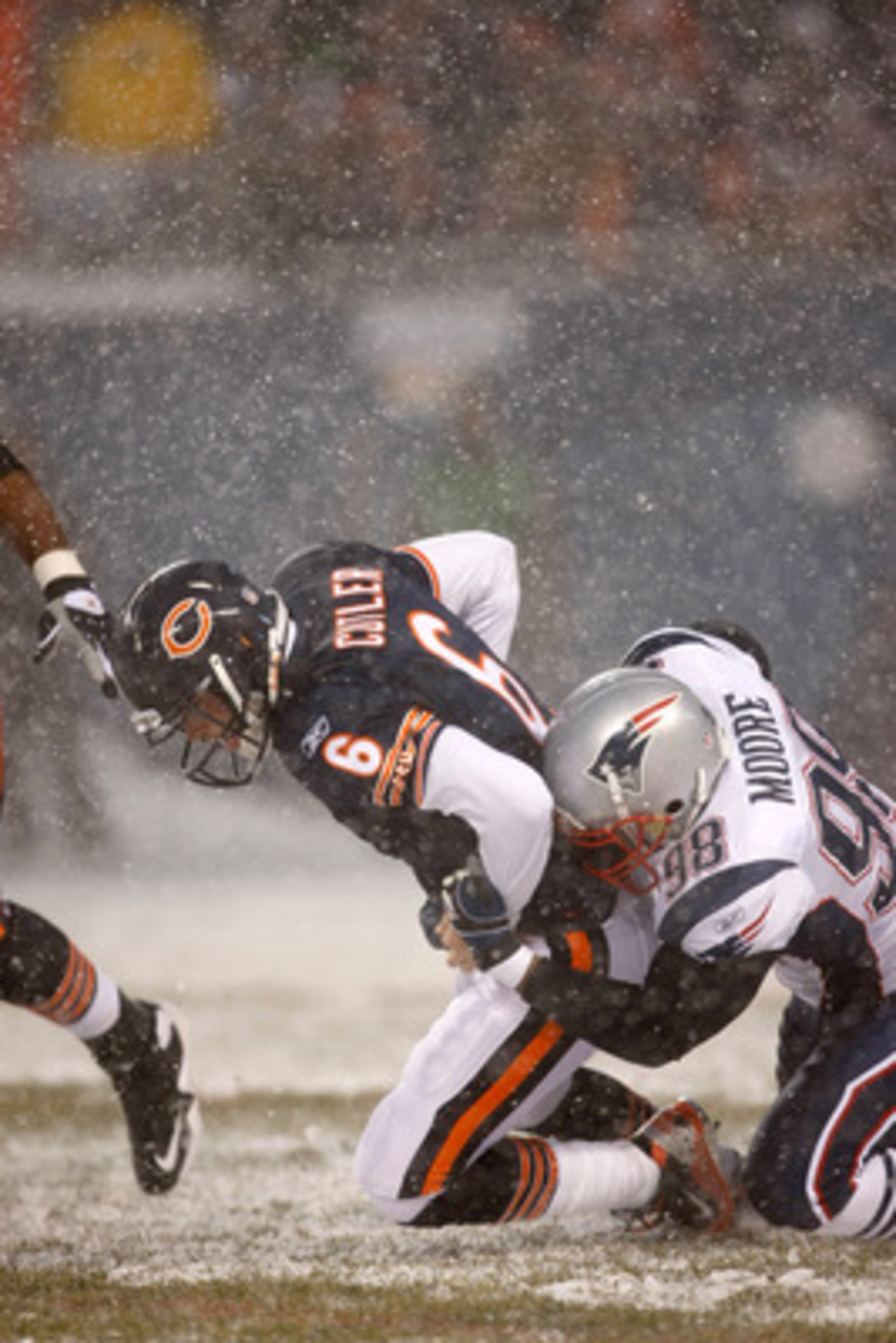 CHICAGO, IL - DECEMBER 12: Eric Moore #98 of the New England Patriots sacks quarterback Jay Cutler #6 of the Chicago Bears at Soldier Field on December 12, 2010 in Chicago, Illinois. The Patriots defeated the Bears 36-7. (Photo by Scott Boehm/Getty Images