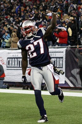 FOXBORO, MA - DECEMBER 19:  Cornerback Kyle Arrington #27 of the New England Patriots celebrates scoring a touchdown after intercepting the ball and running 36 yards against the Green Bay Packers during the third quarter of the game at Gillette Stadium on