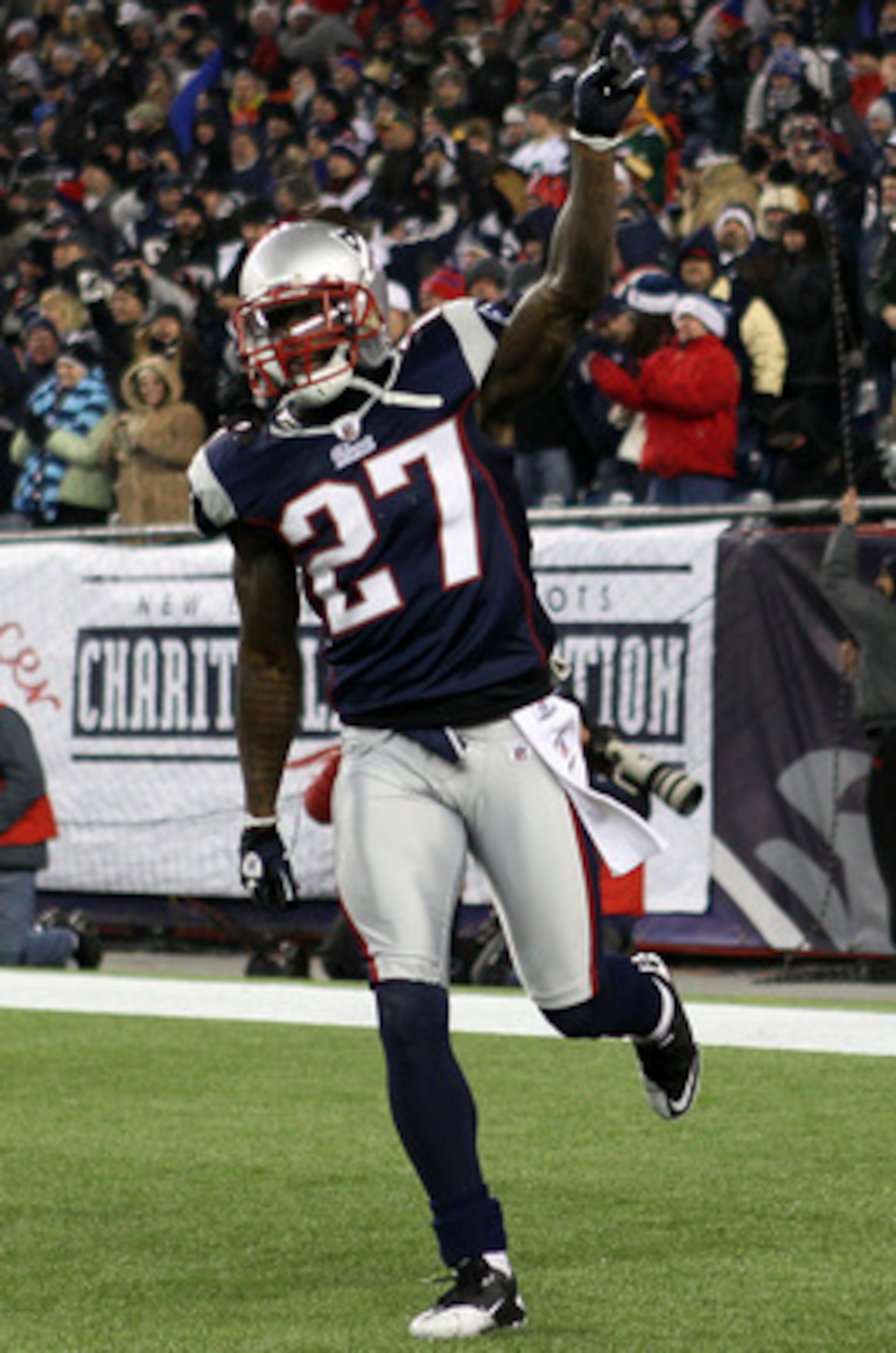 FOXBORO, MA - DECEMBER 19:  Cornerback Kyle Arrington #27 of the New England Patriots celebrates scoring a touchdown after intercepting the ball and running 36 yards against the Green Bay Packers during the third quarter of the game at Gillette Stadium on