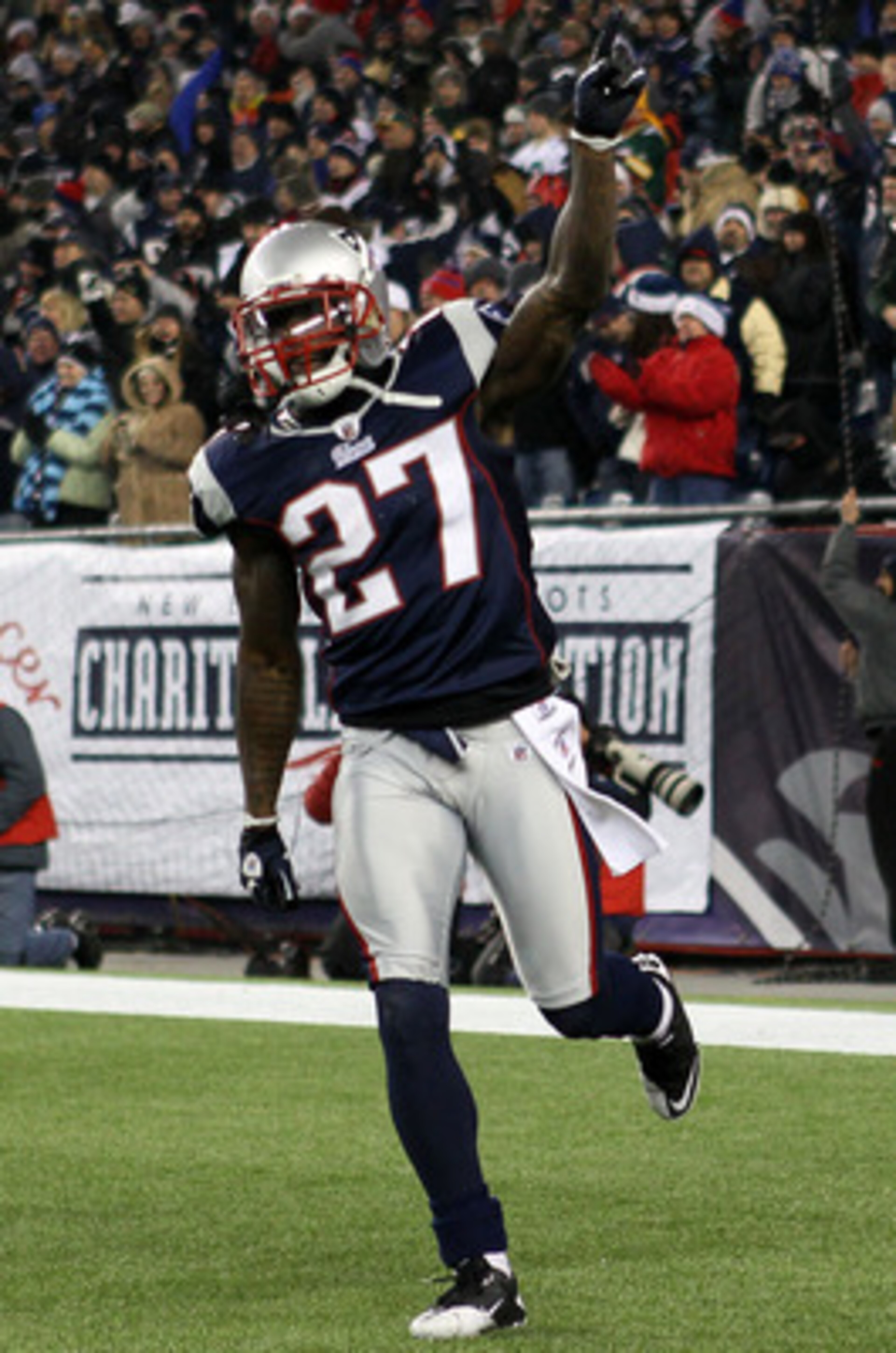 FOXBORO, MA - DECEMBER 19:  Cornerback Kyle Arrington #27 of the New England Patriots celebrates scoring a touchdown after intercepting the ball and running 36 yards against the Green Bay Packers during the third quarter of the game at Gillette Stadium on