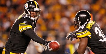 PITTSBURGH - DECEMBER 23:  Ben Roethlisberger #7 of the Pittsburgh Steelers hands the ball off to teammate Rashard Mendenhall #34 during the game against  the Carolina Panthers on December 23, 2010 at Heinz Field in Pittsburgh, Pennsylvania.  (Photo by Ja