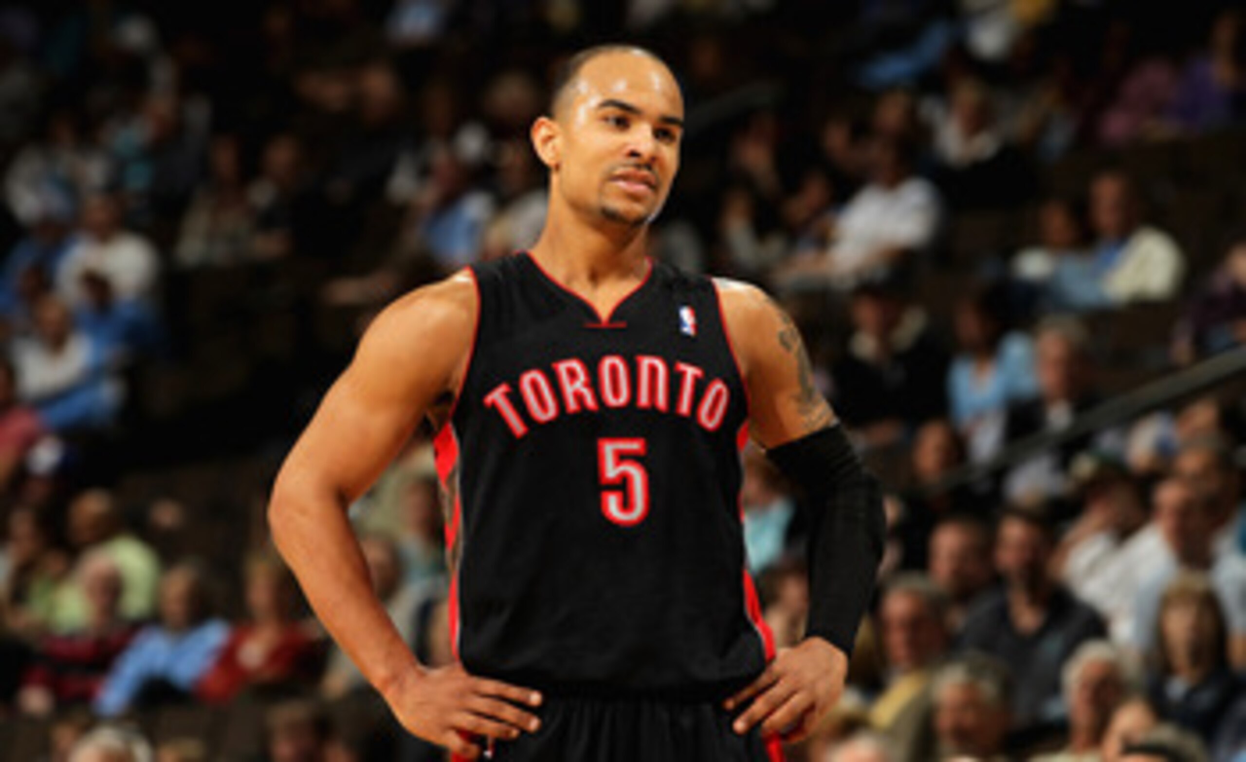 DENVER, CO - MARCH 21:  Jerryd Bayless #5 of the Toronto Raptors looks on during a break in the action against the Denver Nuggets at the Pepsi Center on March 21, 2011 in Denver, Colorado. The Nuggets defeated the Raptors 123-90. NOTE TO USER: User expres