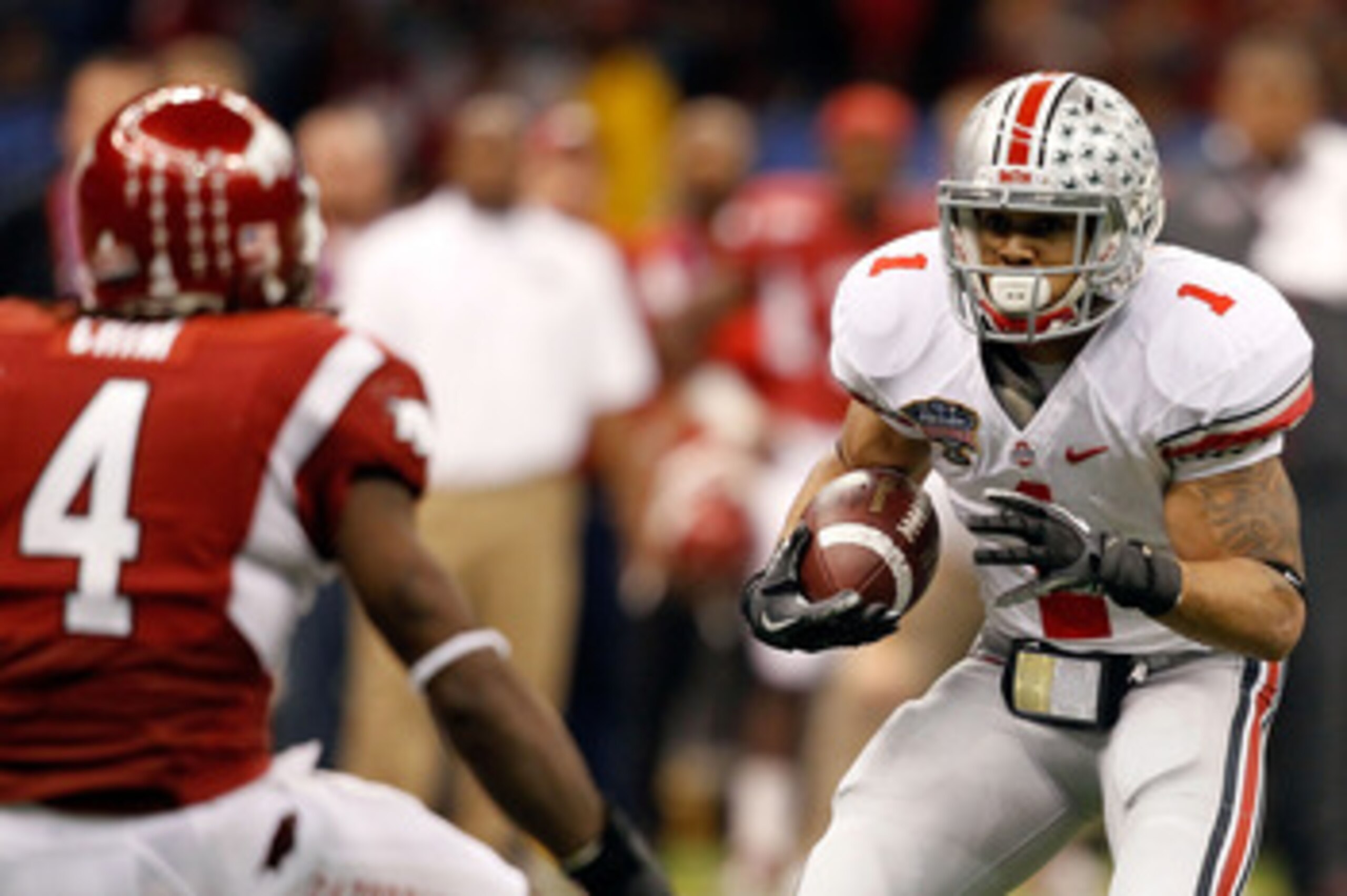 NEW ORLEANS, LA - JANUARY 04:  Dan Herron #1 of the Ohio State Buckeyes runs the ball against the Arkansas Razorbacks during the Allstate Sugar Bowl at the Louisiana Superdome on January 4, 2011 in New Orleans, Louisiana.  (Photo by Matthew Stockman/Getty