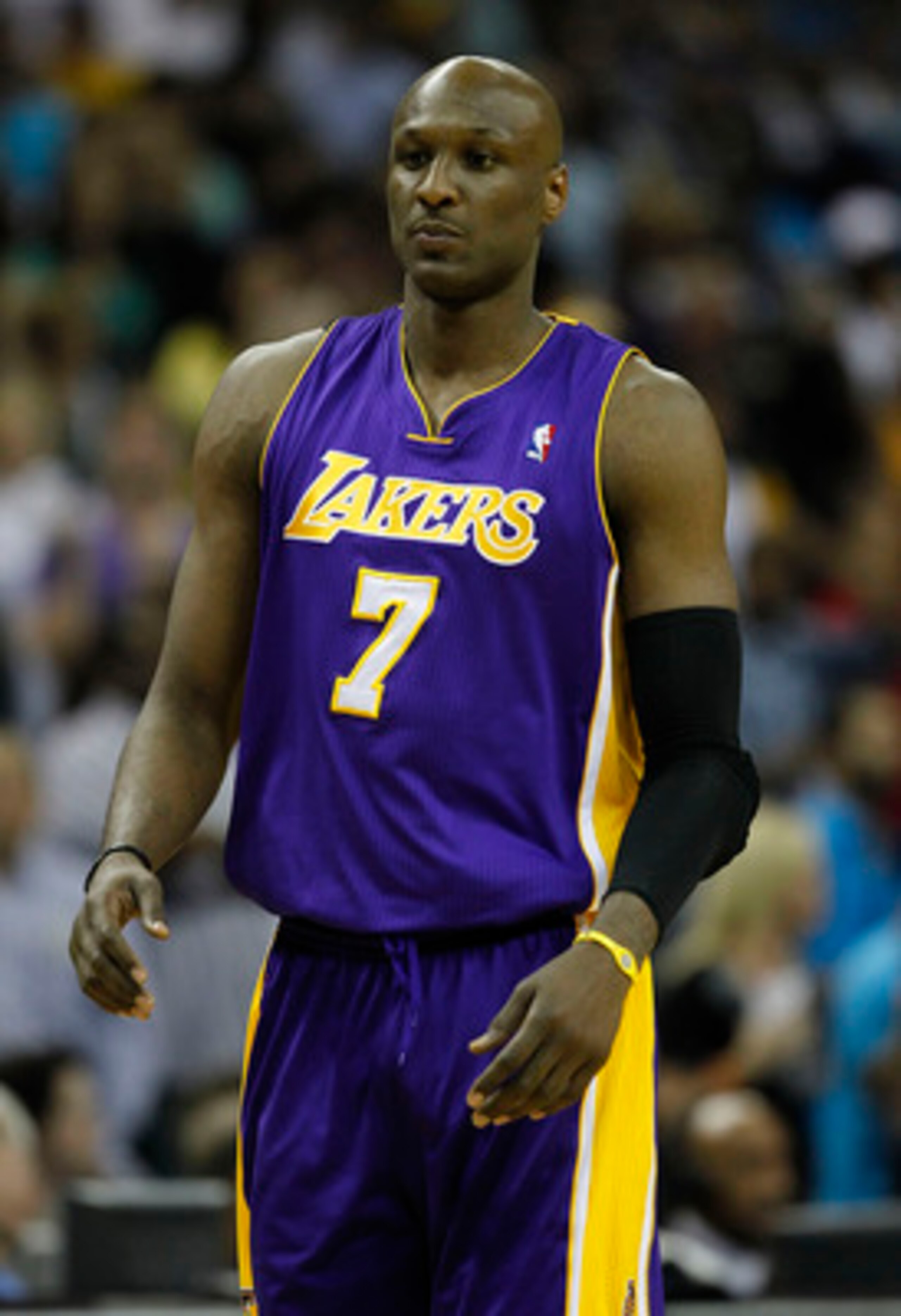 NEW ORLEANS, LA - APRIL 24:  Lamar Odom #7 of the Los Angeles Lakers stands during a freethrow against the New Orleans Hornets in Game Four of the Western Conference Quarterfinals in the 2011 NBA Playoffs at New Orleans Arena on April 24, 2011 in New Orle