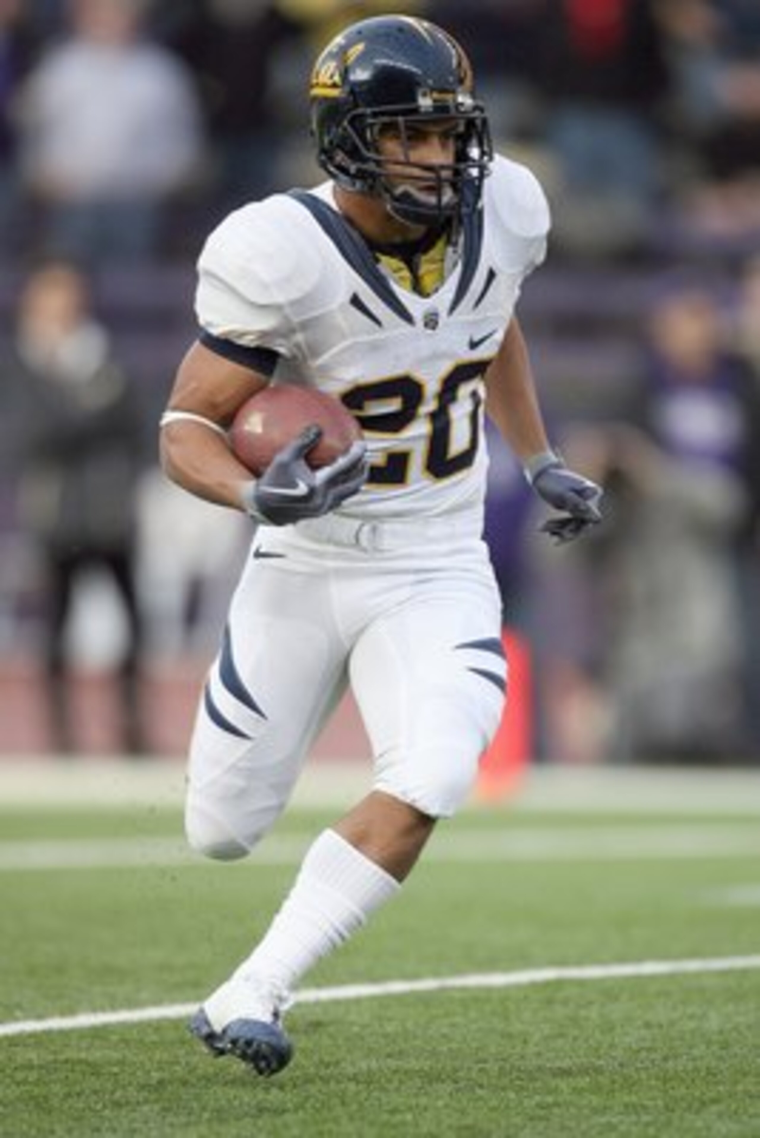 SEATTLE - DECEMBER 05:  Isi Sofele #20 of the California Bears carries the ball during the game against the Washington Huskies on December 5, 2009 at Husky Stadium in Seattle, Washington. The Huskies defeated the Bears 42-10. (Photo by Otto Greule Jr/Gett