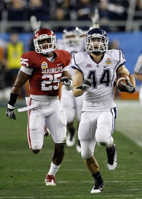 GLENDALE, AZ - JANUARY 01:  Robbie Frey #44 of the Connecticut Huskies score a 95-yard kick return for a touchdown in the third quarter against the Oklahoma Sooners in the Tostitos Fiesta Bowl at the Universtity of Phoenix Stadium on January 1, 2011 in Gl