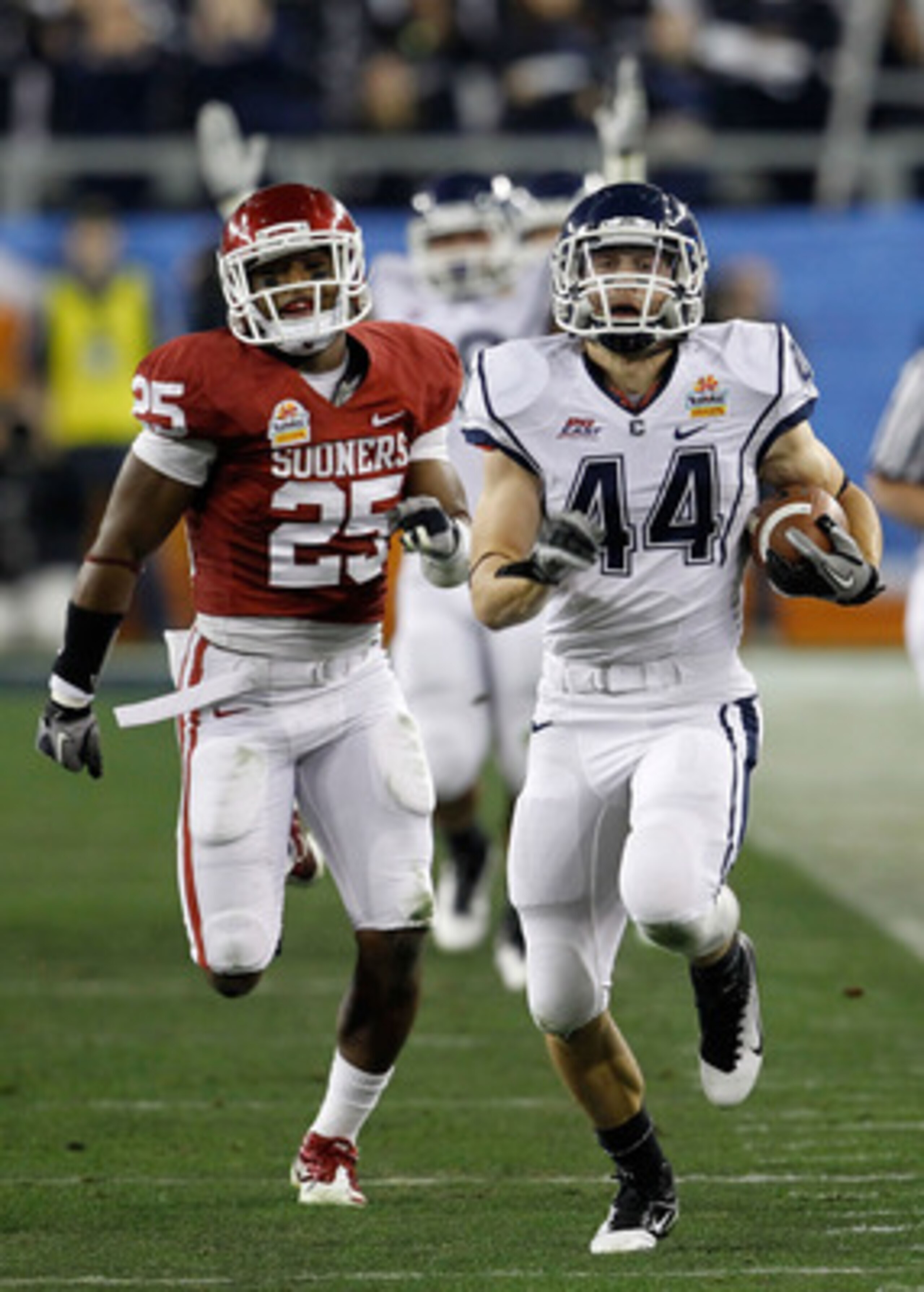GLENDALE, AZ - JANUARY 01:  Robbie Frey #44 of the Connecticut Huskies score a 95-yard kick return for a touchdown in the third quarter against the Oklahoma Sooners in the Tostitos Fiesta Bowl at the Universtity of Phoenix Stadium on January 1, 2011 in Gl