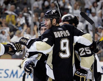 PITTSBURGH, PA - APRIL 23:  Chris Conner #16 of the Pittsburgh Penguins celebrates his third period goal with Pascal Dupuis #9 against the Tampa Bay Lightning in Game Five of the Eastern Conference Quarterfinals during the 2011 NHL Stanley Cup Playoffs at