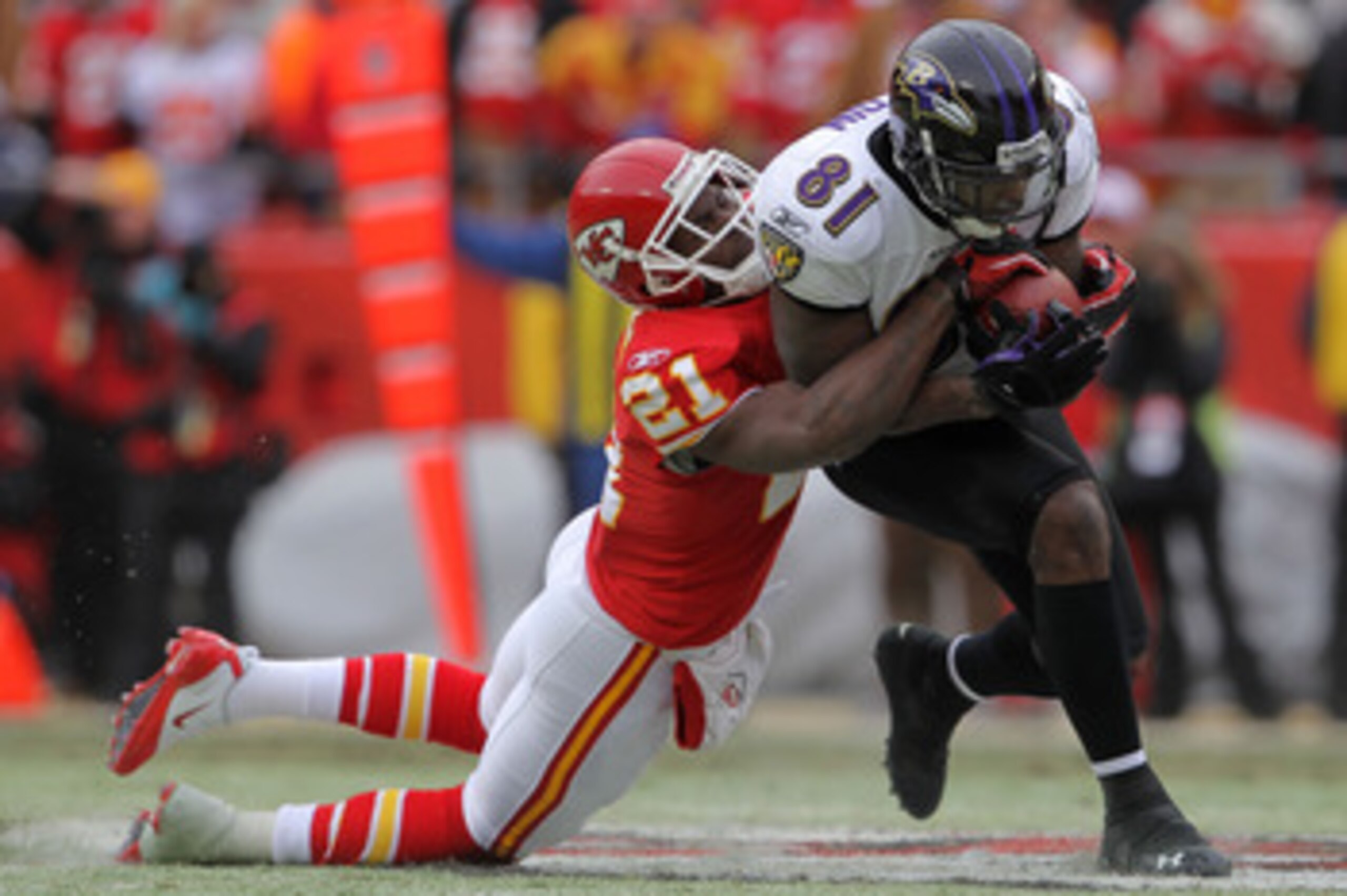 KANSAS CITY, MO - JANUARY 09:  Wide receiver Anquan Boldin #81 of the Baltimore Ravens is tackled after a catch by cornerback Javier Arenas #21 of the Kansas City Chiefs in the first half of their 2011 AFC wild card playoff game at Arrowhead Stadium on Ja