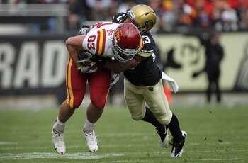 BOULDER, CO - NOVEMBER 13:  Wide receiver Jake Williams #83 of the Iowa State Cyclones makes a first down reception and is tackled by Jalil Brown #23 of the Colorado Buffaloes at Folsom Field on November 13, 2010 in Boulder, Colorado. Colorado defeated Io
