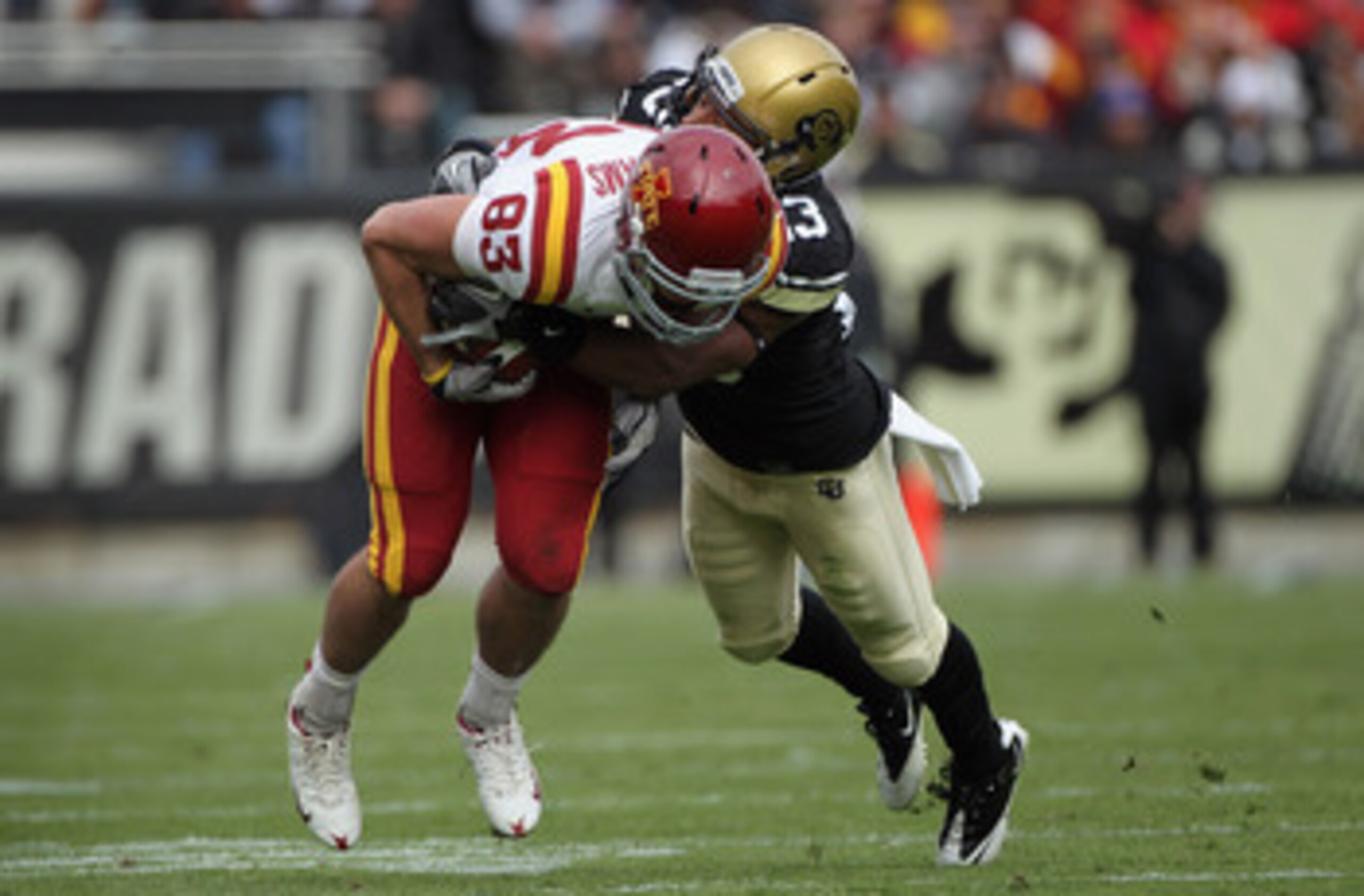 BOULDER, CO - NOVEMBER 13:  Wide receiver Jake Williams #83 of the Iowa State Cyclones makes a first down reception and is tackled by Jalil Brown #23 of the Colorado Buffaloes at Folsom Field on November 13, 2010 in Boulder, Colorado. Colorado defeated Io