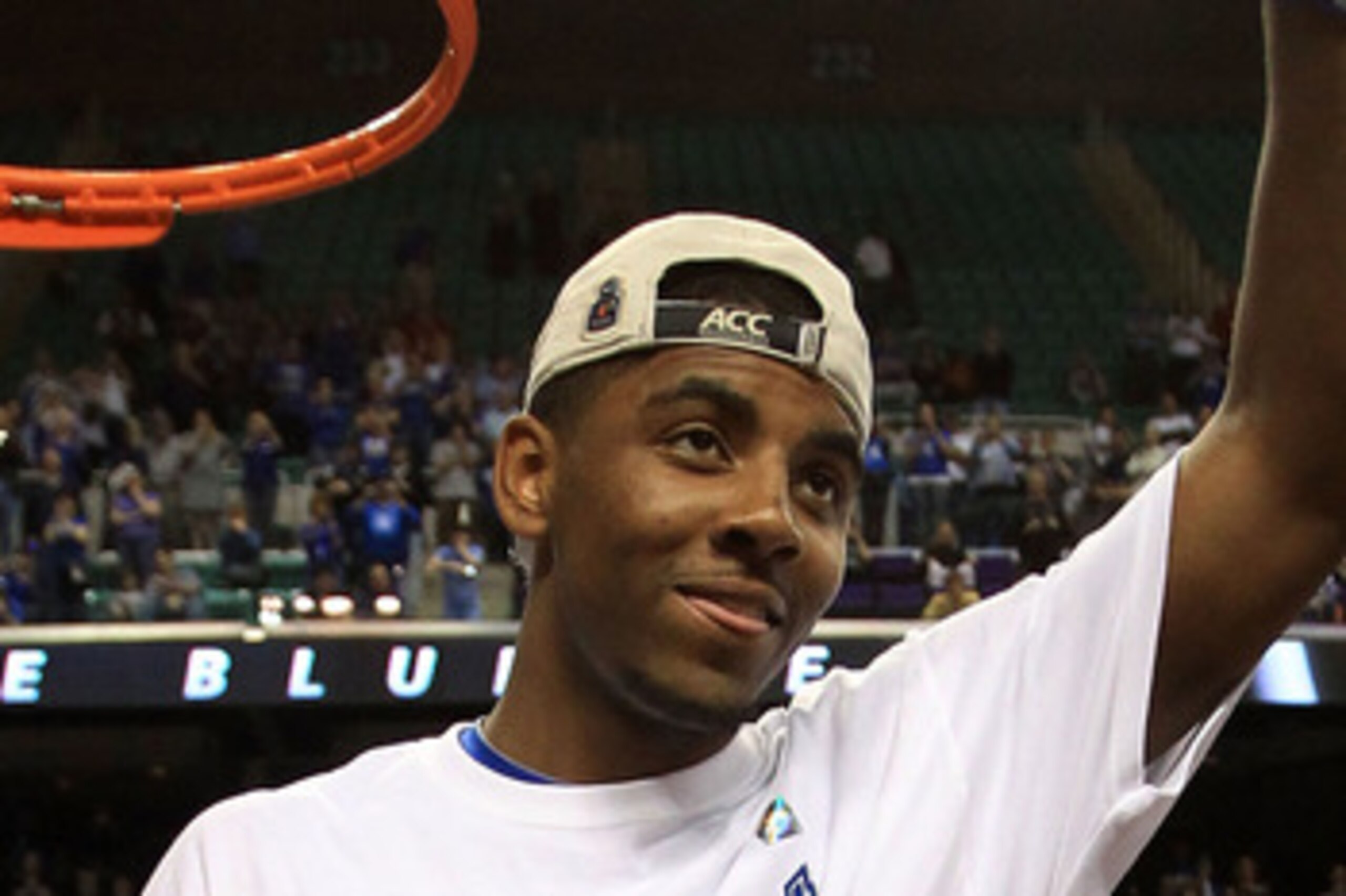 GREENSBORO, NC - MARCH 13:  Kyrie Irving #1 of the Duke Blue Devils cuts down the net after defeating the North Carolina Tar Heels 75-58 in the championship game of the 2011 ACC men's basketball tournament at the Greensboro Coliseum on March 13, 2011 in G
