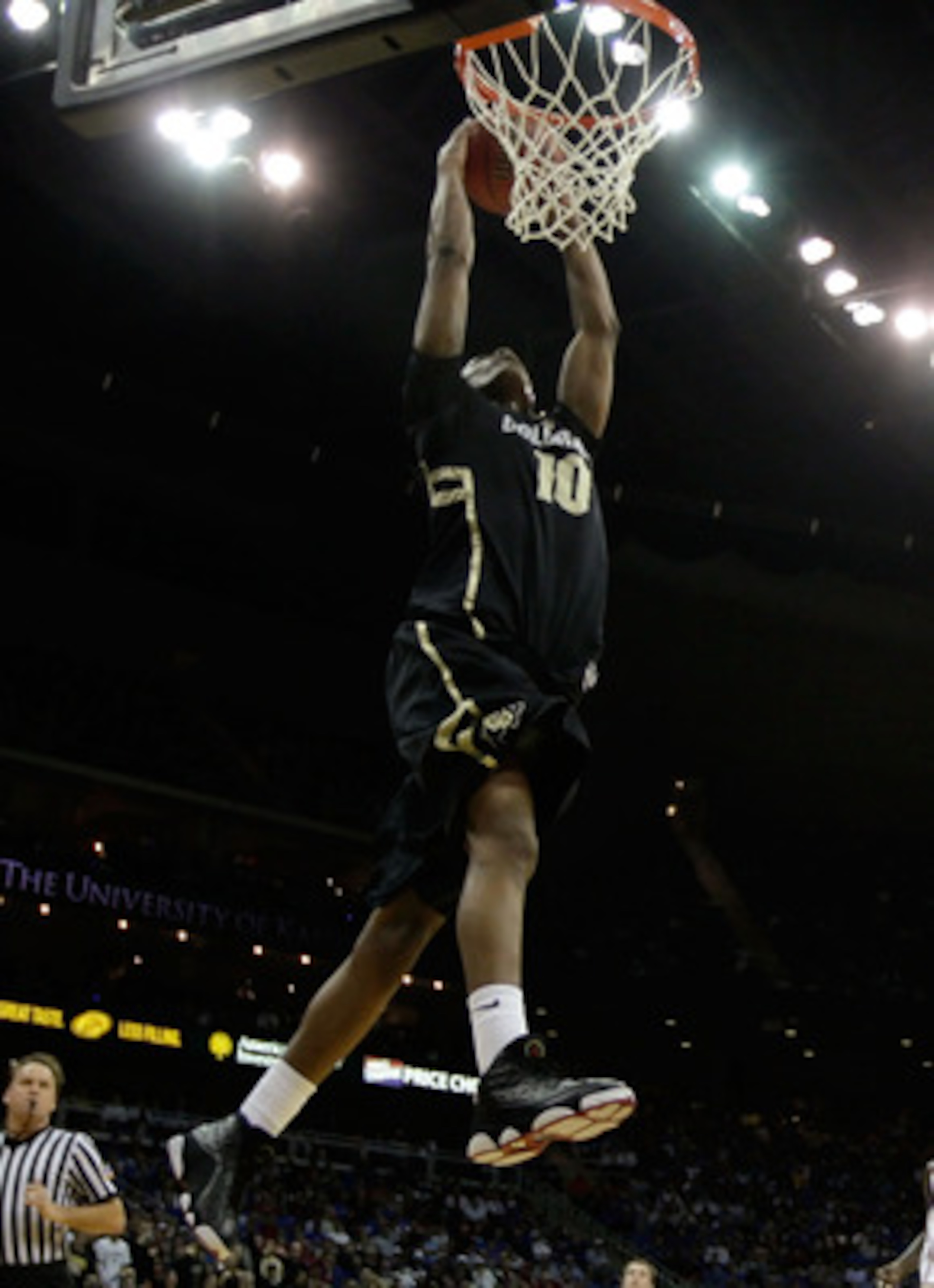 KANSAS CITY, MO - MARCH 11: Alec Burks #10 of the Colorado Buffaloes dunks the ball against the Kansas Jayhawks during their semifinal game in the 2011 Phillips 66 Big 12 Men's Basketball Tournament at Sprint Center on March 11, 2011 in Kansas City, Miss KANSAS CITY, MO - MARCH 11: Alec Burks #10 of the Colorado Buffaloes dunks the ball against the Kansas Jayhawks during their semifinal game in the 2011 Phillips 66 Big 12 Men's Basketball Tournament at Sprint Center on March 11, 2011 in Kansas City, Miss