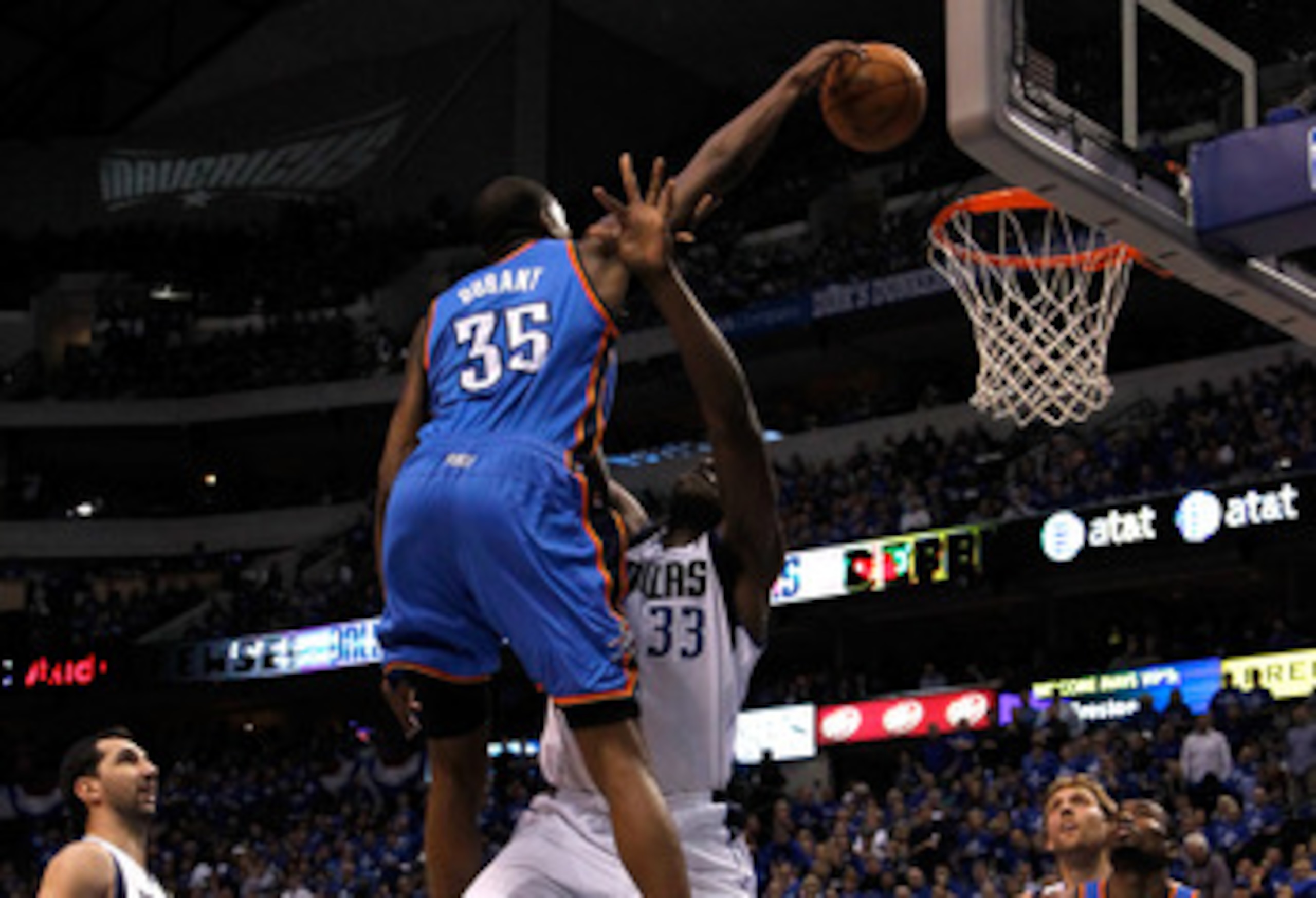 DALLAS, TX - MAY 19:  Kevin Durant #35 of the Oklahoma City Thunder dunks the ball over Brendan Haywood #33 of the Dallas Mavericks as Haywood is called for a foul in the first quarter in Game Two of the Western Conference Finals during the 2011 NBA Playo