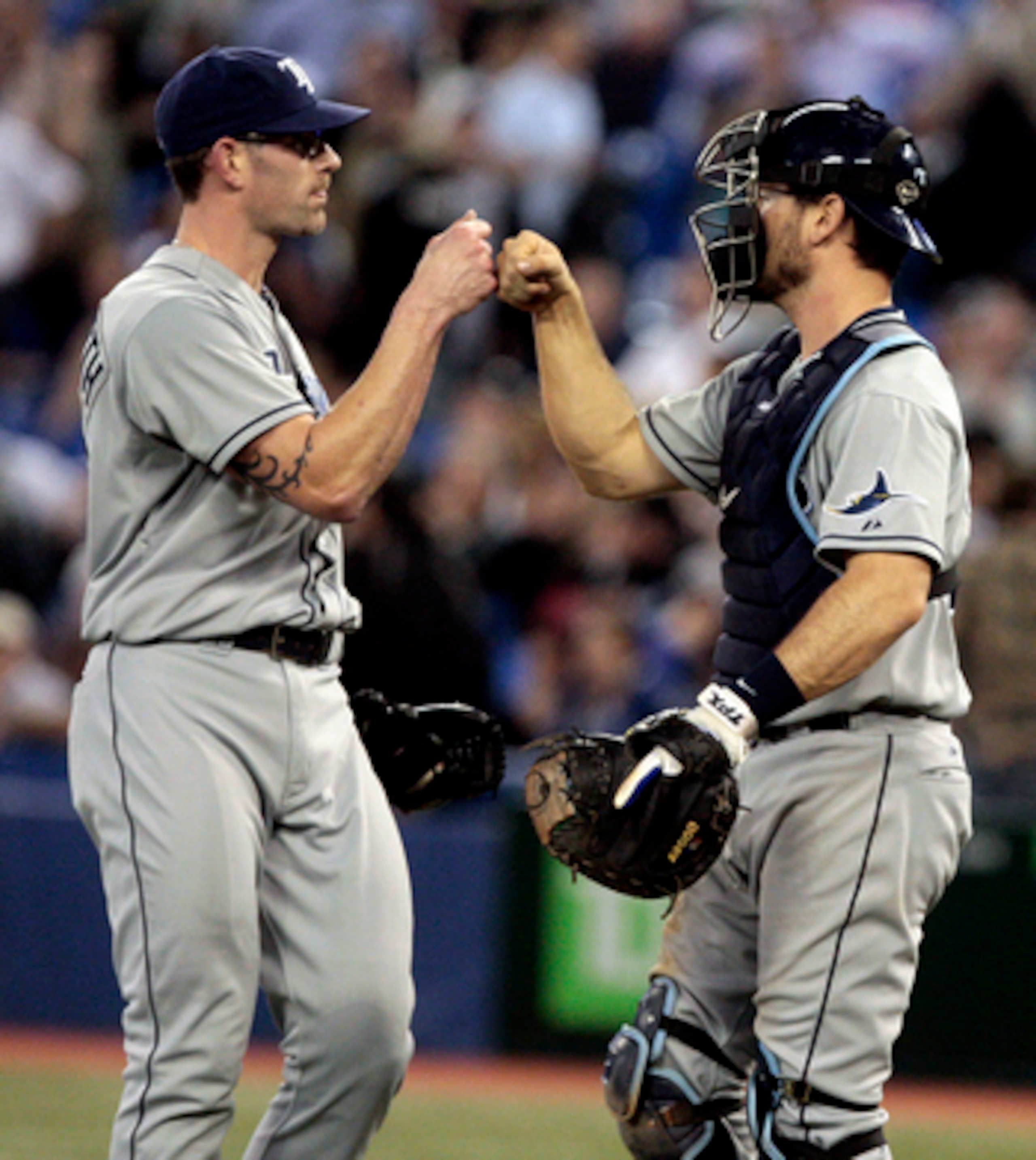 TORONTO, CANADA - MAY 18: Kyle Farnsworth #43 and John Jaso #28 of the Tampa Bay Rays celebrate win against the Toronto Blue Jays during MLB action at the Rogers Centre May 18, 2011 in Toronto, Ontario, Canada. (Photo by Abelimages/Getty Images)