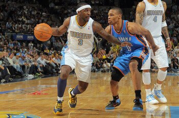 DENVER, CO - APRIL 25: Ty Lawson #3 of the Denver Nuggets dribbes the ball against Russell Westbrook #0 of the Oklahoma City Thunder in Game Four of the Western Conference Quarterfinals in the 2011 NBA Playoffs on April 24, 2011 at the Pepsi Center in De DENVER, CO - APRIL 25: Ty Lawson #3 of the Denver Nuggets dribbes the ball against Russell Westbrook #0 of the Oklahoma City Thunder in Game Four of the Western Conference Quarterfinals in the 2011 NBA Playoffs on April 24, 2011 at the Pepsi Center in De