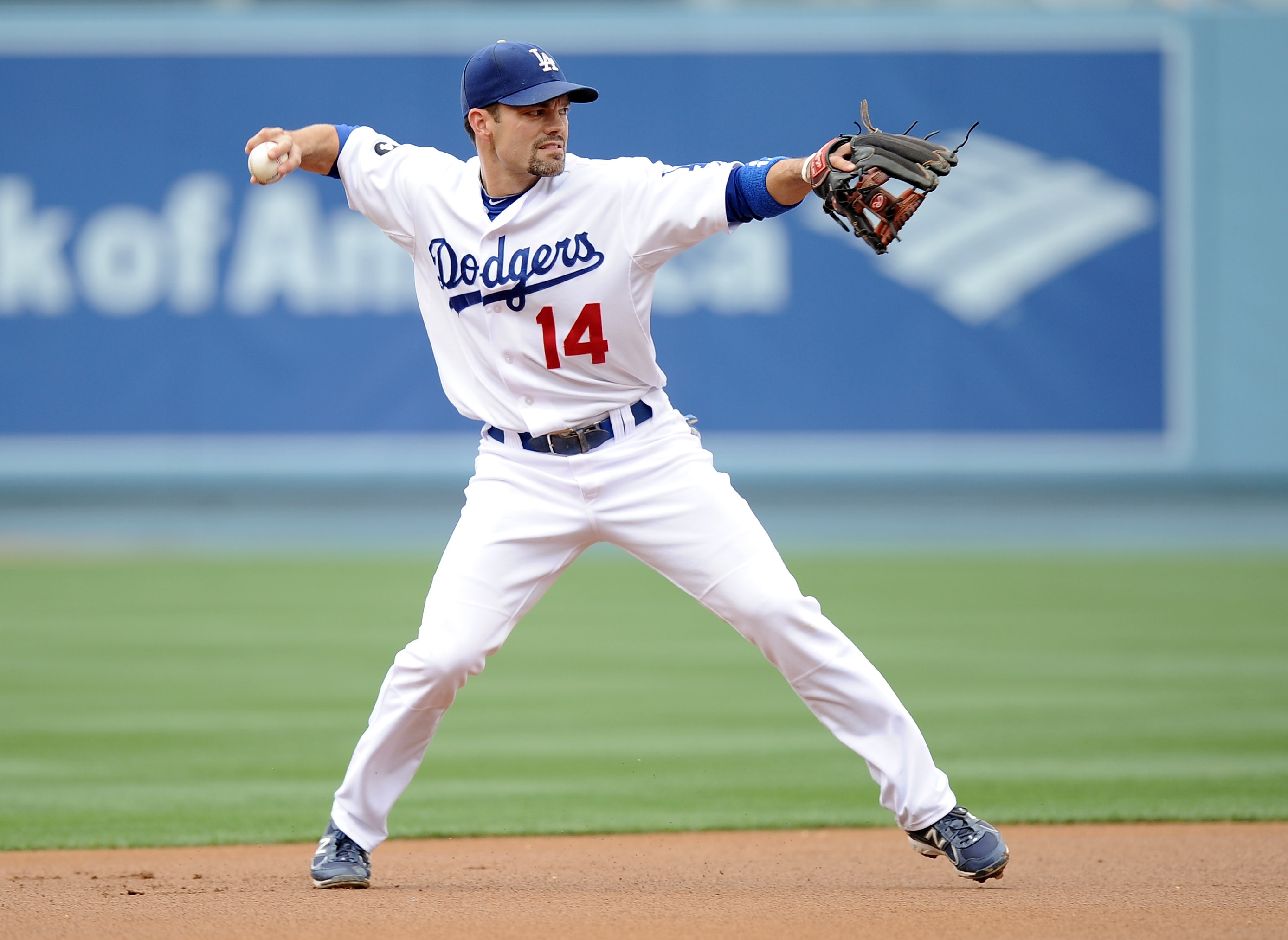 LOS ANGELES, CA - MAY 14:  Jamey Carroll #14 of the Los Angeles Dodgers makes a throw to first base for an out against the Arizona Diamondbacks at Dodger Stadium on May 14, 2011 in Los Angeles, California.  (Photo by Harry How/Getty Images)