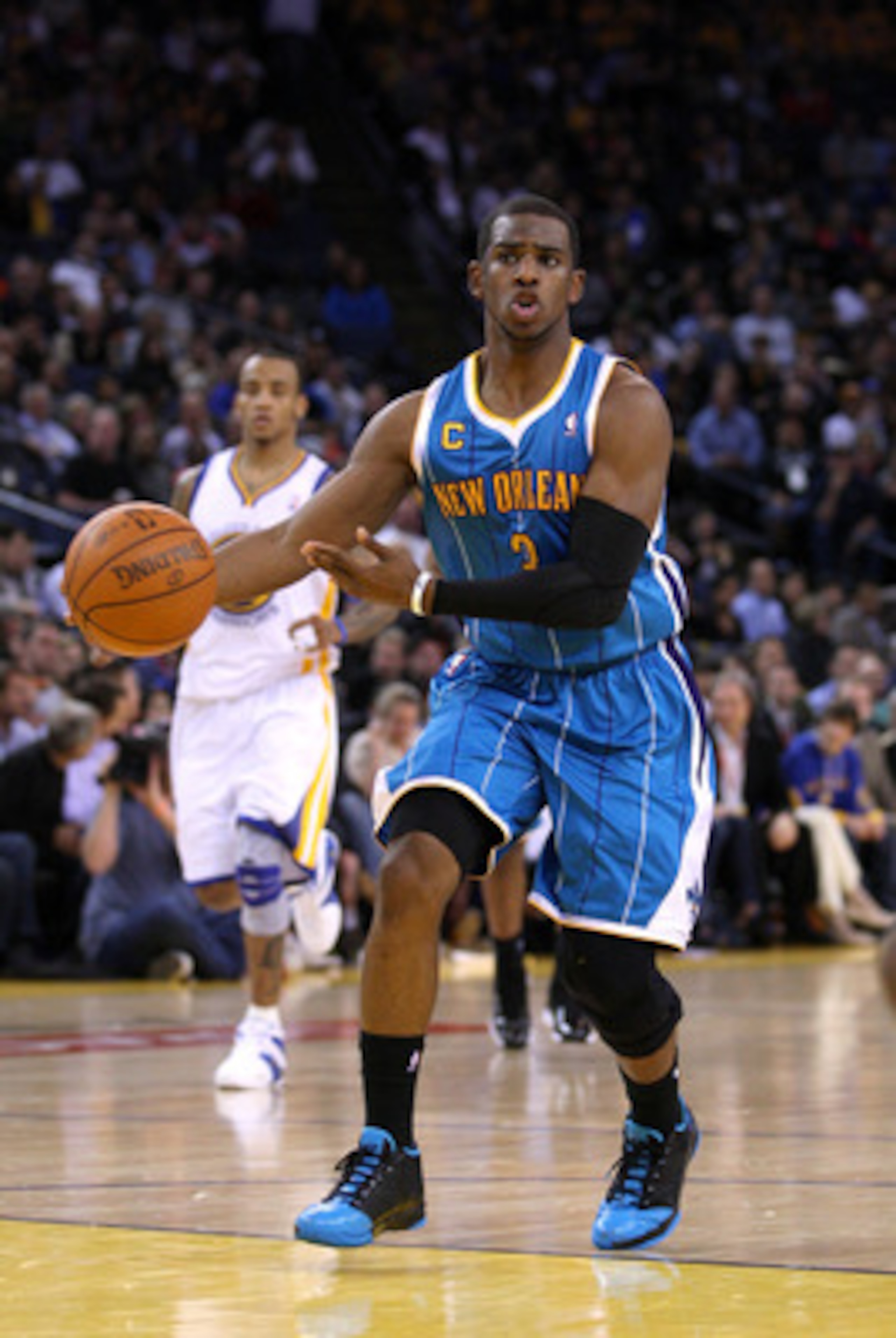 OAKLAND, CA - JANUARY 26:  Chris Paul #3 of the New Orleans Hornets passes the ball during their game against the Golden State Warriors at Oracle Arena on January 26, 2011 in Oakland, California.  NOTE TO USER: User expressly acknowledges and agrees that,