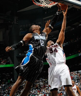 ATLANTA, GA - APRIL 24: Jason Collins #34 of the Atlanta Hawks against the Dwight Howard #12 of the Orlando Magic during Game Four of the Eastern Conference Quarterfinals in the 2011 NBA Playoffs at Philips Arena on April 24, 2011 in Atlanta, Georgia. N ATLANTA, GA - APRIL 24: Jason Collins #34 of the Atlanta Hawks against the Dwight Howard #12 of the Orlando Magic during Game Four of the Eastern Conference Quarterfinals in the 2011 NBA Playoffs at Philips Arena on April 24, 2011 in Atlanta, Georgia. N