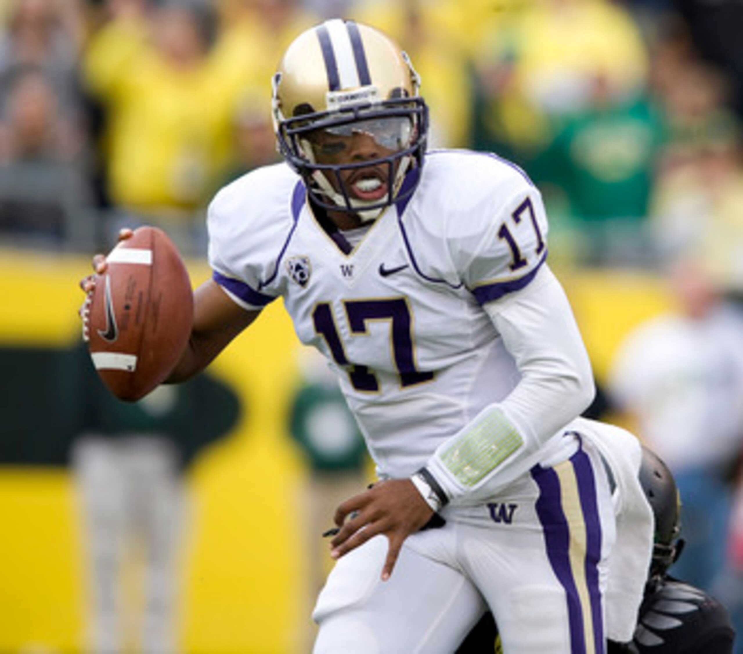 EUGENE, OR - NOVEMBER 06: Quarterback Keith Price #17 of the Washington Huskies scrambles out of the pocket in the third quarter of the game against the Oregon Ducks at Autzen Stadium on November 6, 2010 in Eugene, Oregon. The Ducks won the game 53-16. (P EUGENE, OR - NOVEMBER 06: Quarterback Keith Price #17 of the Washington Huskies scrambles out of the pocket in the third quarter of the game against the Oregon Ducks at Autzen Stadium on November 6, 2010 in Eugene, Oregon. The Ducks won the game 53-16. (P