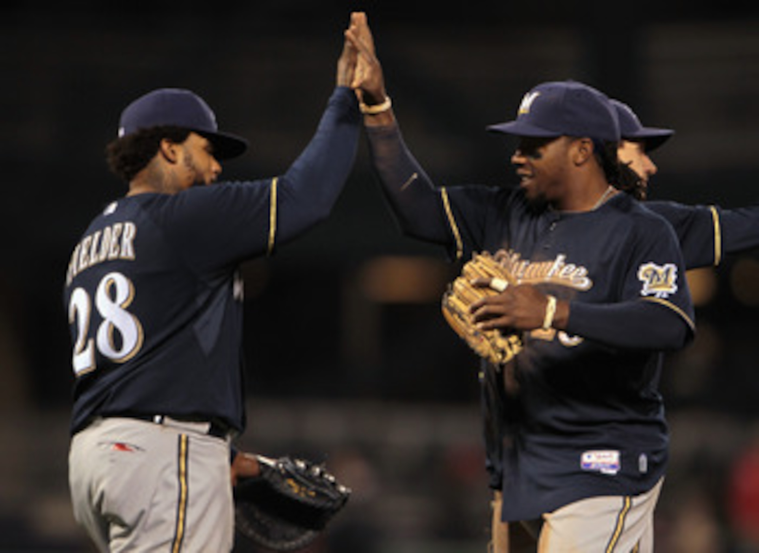 PITTSBURGH, PA - APRIL 13:  Prince Fielder #28 (L)of the Milwaukee Brewers high-fives his teammate Rickie Weeks #23 after defeating the Pittsburgh Pirates 6-0 at PNC Park on April 13, 2011 in Pittsburgh, Pennsylvania.  (Photo by Scott Halleran/Getty Image