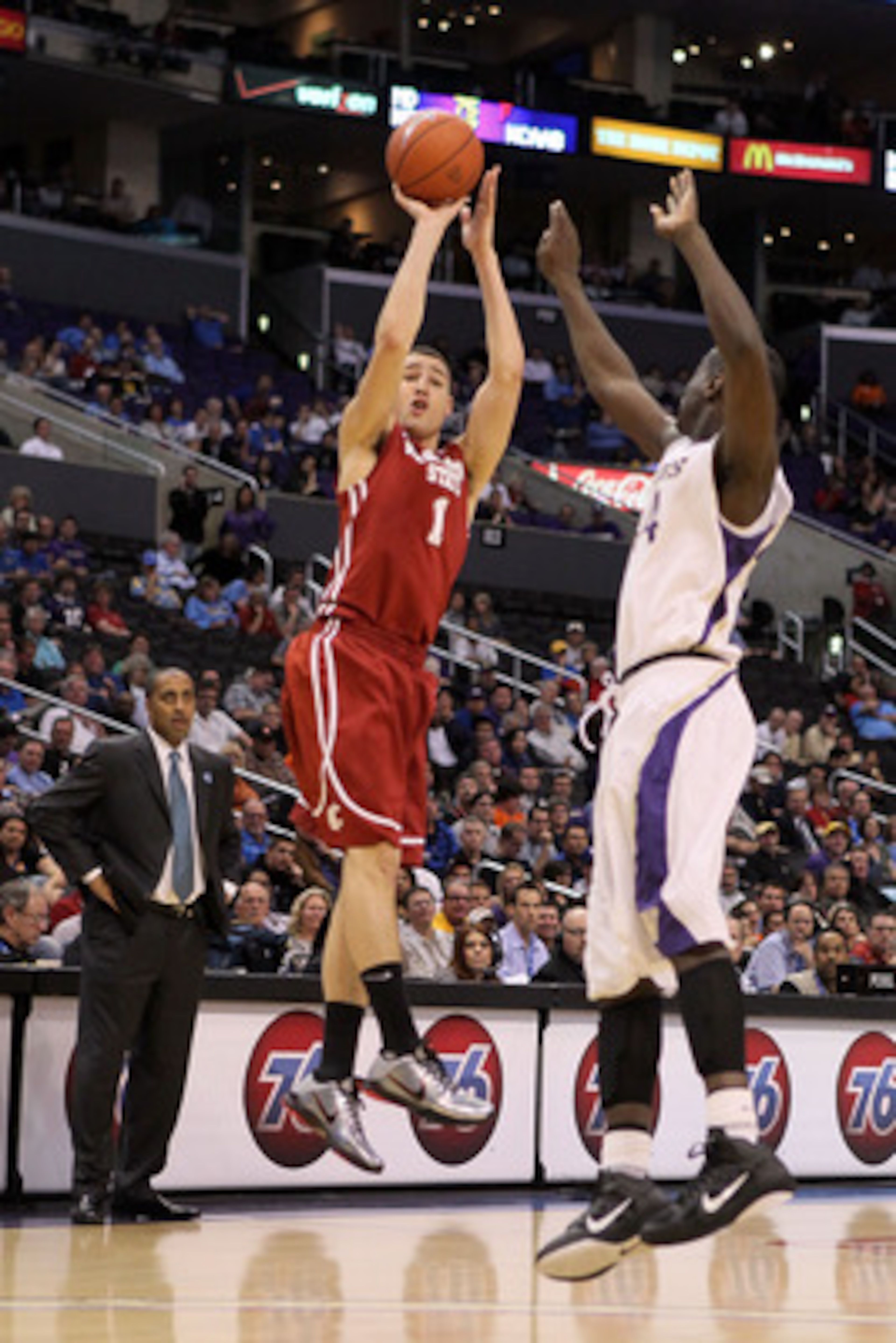 LOS ANGELES, CA - MARCH 10:  Klay Thompson #1 of the Washington State Cougars shoots over Darnell Gant #44 of the Washington Huskies in the first half in the quarterfinals of the 2011 Pacific Life Pac-10 Men's Basketball Tournament at Staples Center on Ma