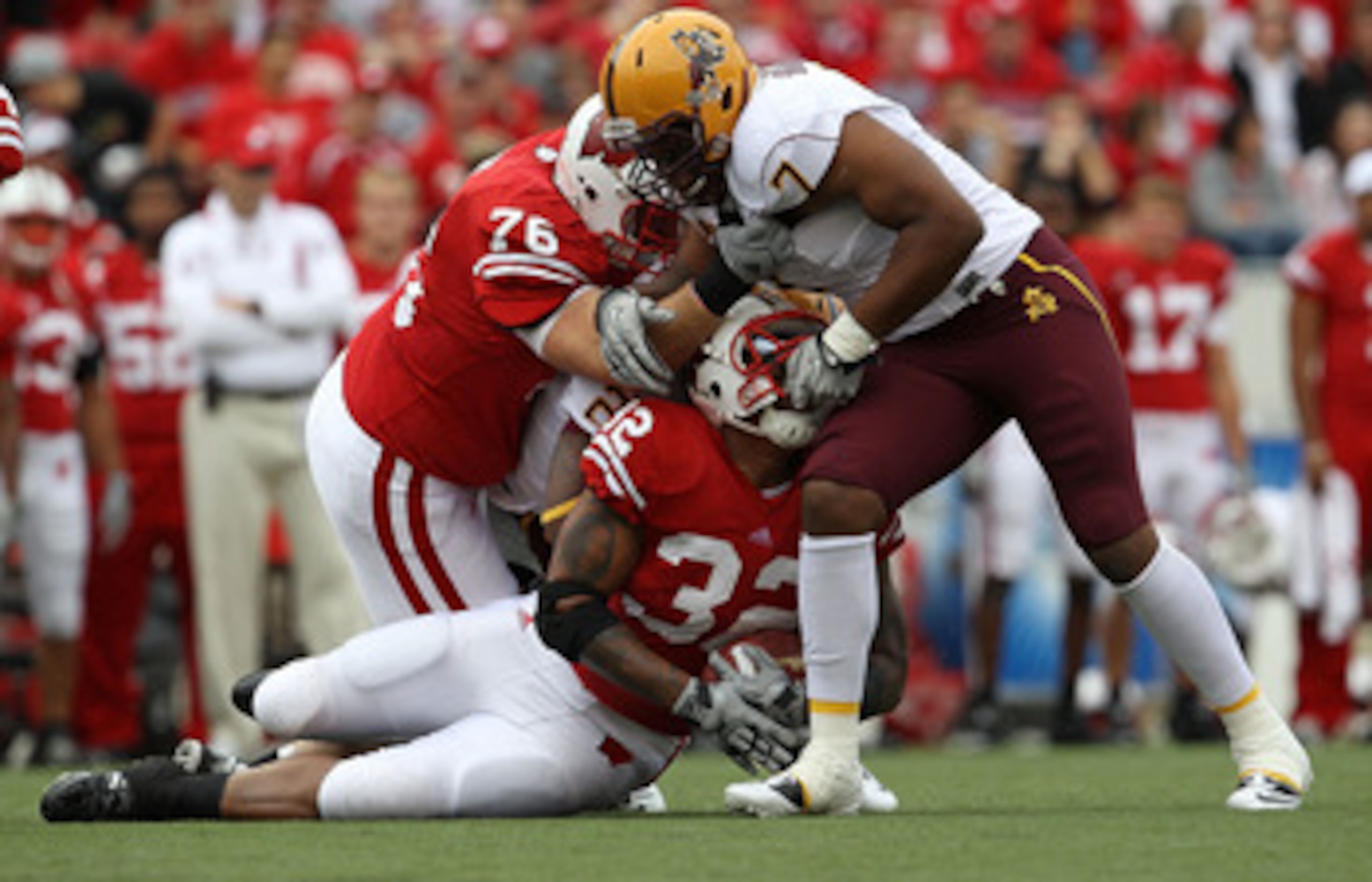 MADISON, WI - SEPTEMBER 18: John Clay #32 of the Wisconsin Badgers is tackled by the face mask by Vontaze Burfict #7 of the Arizona State Sun Devils at Camp Randall Stadium on September 18, 2010 in Madison, Wisconsin. (Photo by Jonathan Daniel/Getty Image