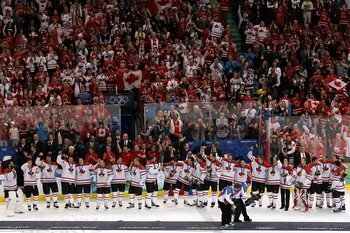 VANCOUVER, BC - FEBRUARY 28:  Team Canada acknowledge the fans after receiving their gold medals and the playing of the Canadian National Anthem in the ice hockey men's gold medal game between USA and Canada on day 17 of the Vancouver 2010 Winter Olympics