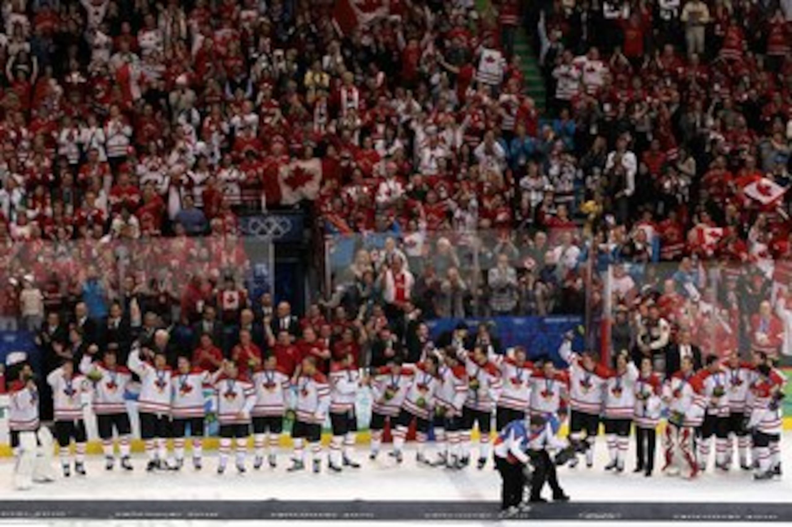 VANCOUVER, BC - FEBRUARY 28: Team Canada acknowledge the fans after receiving their gold medals and the playing of the Canadian National Anthem in the ice hockey men's gold medal game between USA and Canada on day 17 of the Vancouver 2010 Winter Olympics VANCOUVER, BC - FEBRUARY 28: Team Canada acknowledge the fans after receiving their gold medals and the playing of the Canadian National Anthem in the ice hockey men's gold medal game between USA and Canada on day 17 of the Vancouver 2010 Winter Olympics