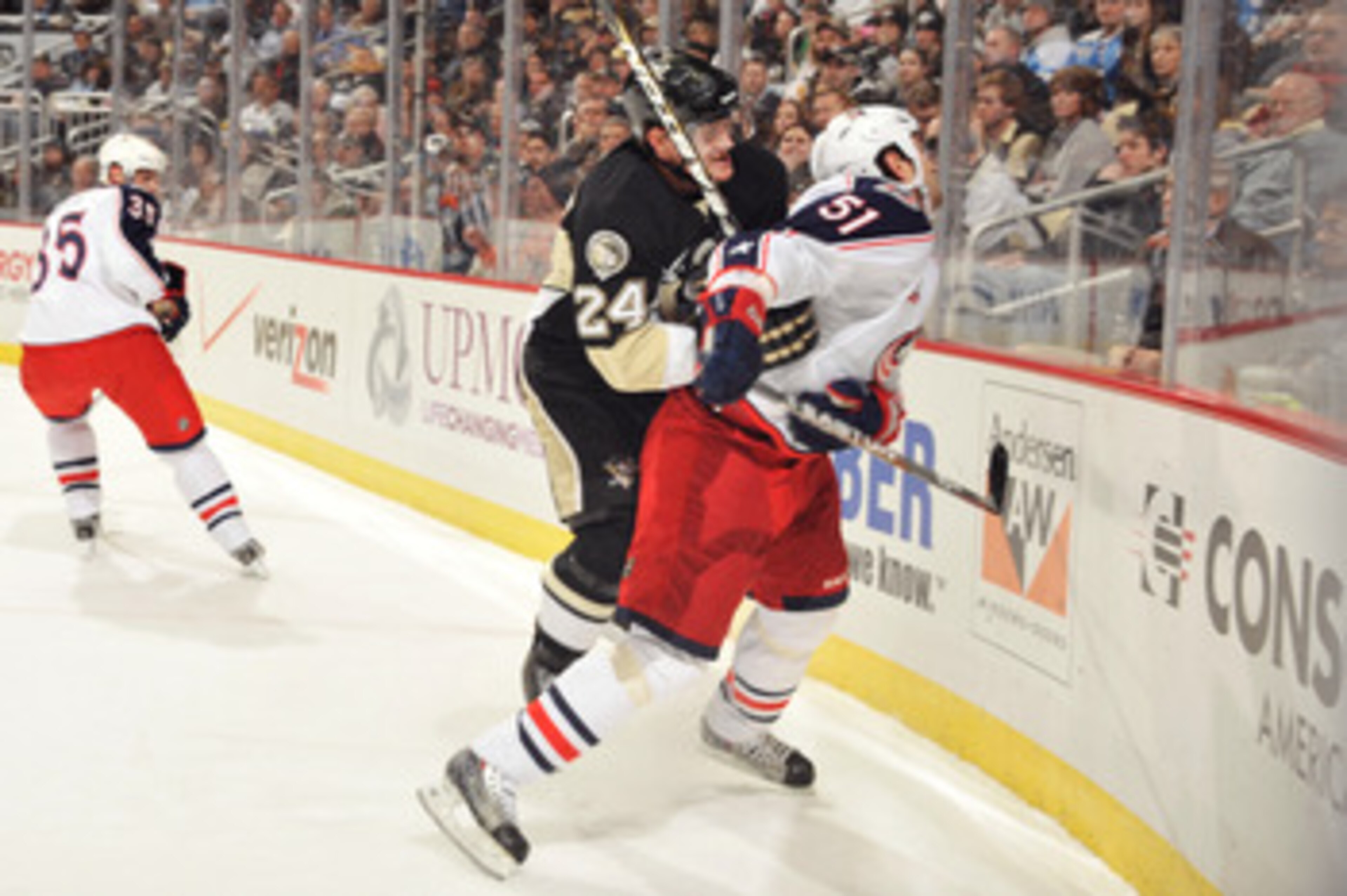 PITTSBURGH, PA - FEBRUARY 8:  Matt Cooke #24 of the Pittsburgh Penguins checks Fedor Tyutin #51 of the Columbus Blue Jackets in the first period on February 8, 2011 at CONSOL Energy Center in Pittsburgh, Pennsylvania. Cooke was assessed a five-minute majo