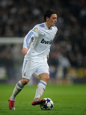 MADRID, SPAIN - JANUARY 13: Mesut Ozil of Real Madrid controls the ball during the Copa del Rey quarter final first leg match between Real Madrid and Atletico Madrid at Estadio Santiago Bernabeu on January 13, 2011 in Madrid, Spain.  (Photo by Denis Doyle