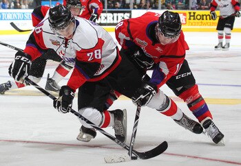 TORONTO, CAN - JANUARY 19:  Matt Puempel #18 of Team Cherry battles for puck control with Nathan Beaulieu #28 of Team Orr in the 2011 Home Hardware Top Prospects game on January 19, 2011 at the Air Canada Centre in Toronto, Canada. Team Orr defeated Team 