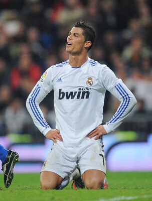 MADRID, SPAIN - JANUARY 13:  Cristiano Ronaldo of Real Madrid reacts during the Copa del Rey quarter final first leg match between Real Madrid and Atletico Madrid at Estadio Santiago Bernabeu on January 13, 2011 in Madrid, Spain.  (Photo by Denis Doyle/Ge