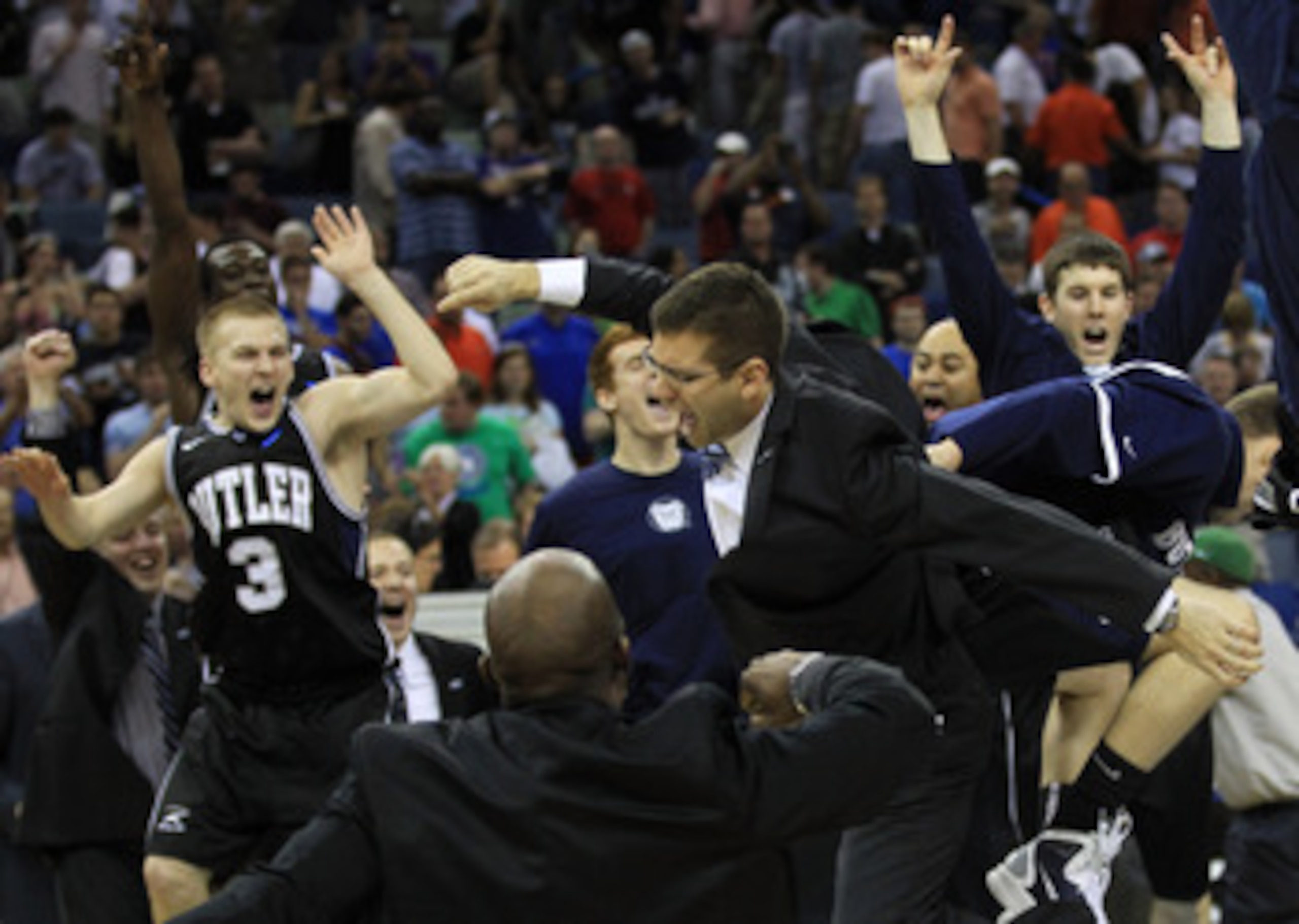 NEW ORLEANS, LA - MARCH 26:  Head coach Brad Stevens of the Butler Bulldogs celebrates with his team after they defeated the Florida Gators 74 to 71 in overtime during the Southeast regional final of the 2011 NCAA men's basketball tournament at New Orlean