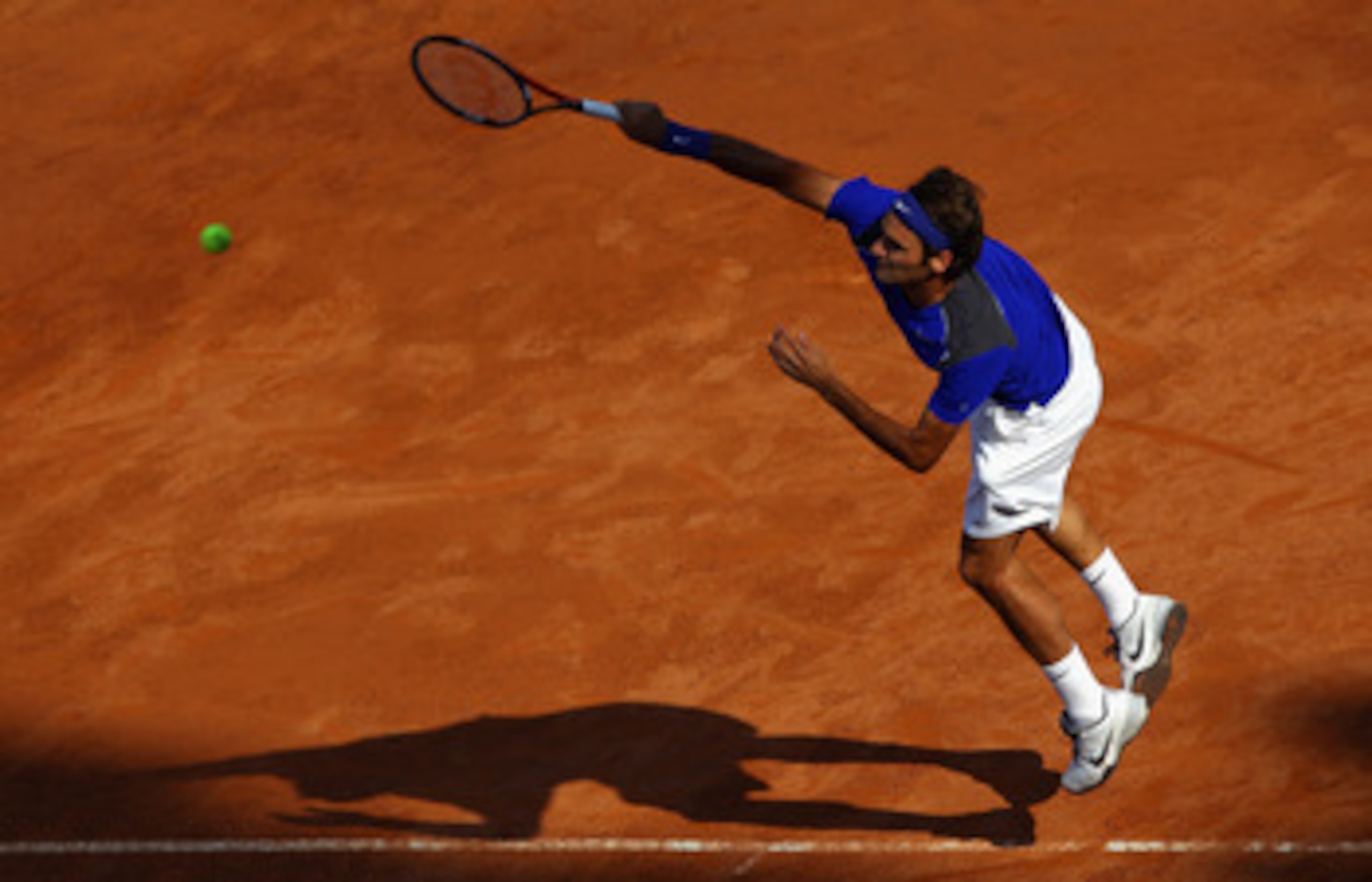 ROME, ITALY - MAY 12:  Roger Federer of Switzerland serves during his third round match against Richard Gasquet of France during day five of the Internazoinali BNL D'Italia at the Foro Italico Tennis Centre on May 12, 2011 in Rome, Italy.  (Photo by Clive