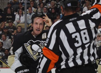 PITTSBURGH - OCTOBER 07: Brooks Orpik #44 of the Pittsburgh Penguins argues a penalty call by referee Francois St. Laurent #38 in his game against  the Philadelphia Flyers at the Consol Energy Center on October 7, 2010 in Pittsburgh, Pennsylvania.  (Photo