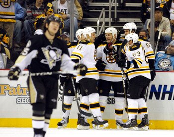PITTSBURGH - NOVEMBER 10:  Shawn Thornton #22 of the Boston Bruins celebrates his third period goal with teammates against the Pittsburgh Penguins at Consol Energy Center on November 10, 2010 in Pittsburgh, Pennsylvania.  The Bruins defeated the Penguins 