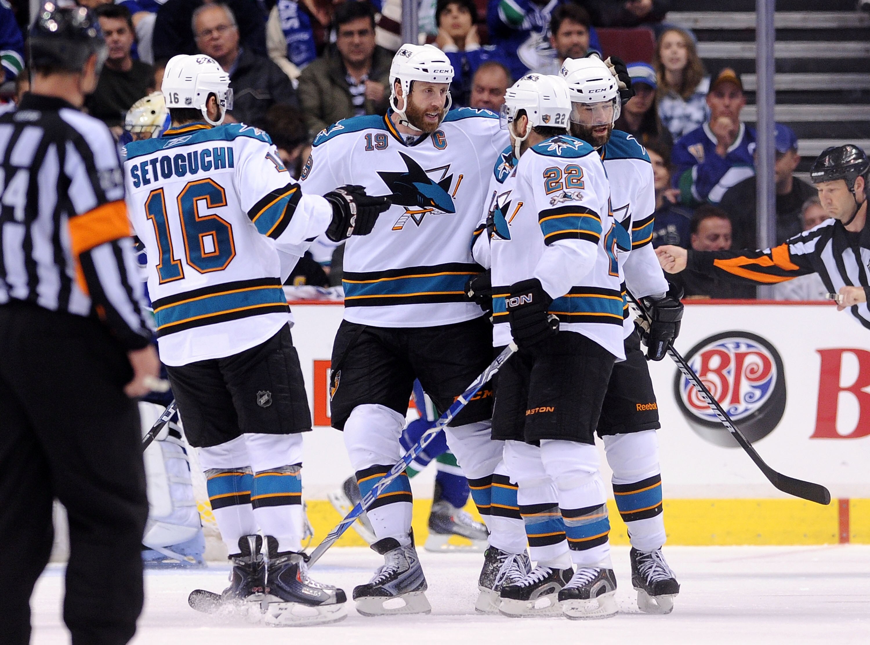 VANCOUVER, CANADA - MAY 15:  Devin Setoguchi #16, Joe Thornton #19 and Dan Boyle #22 of the San Jose Sharks congratulate teammate Patrick Marleau #12 after Marleau's goal against the Vancouver Canucks in the second period in Game One of the Western Confer