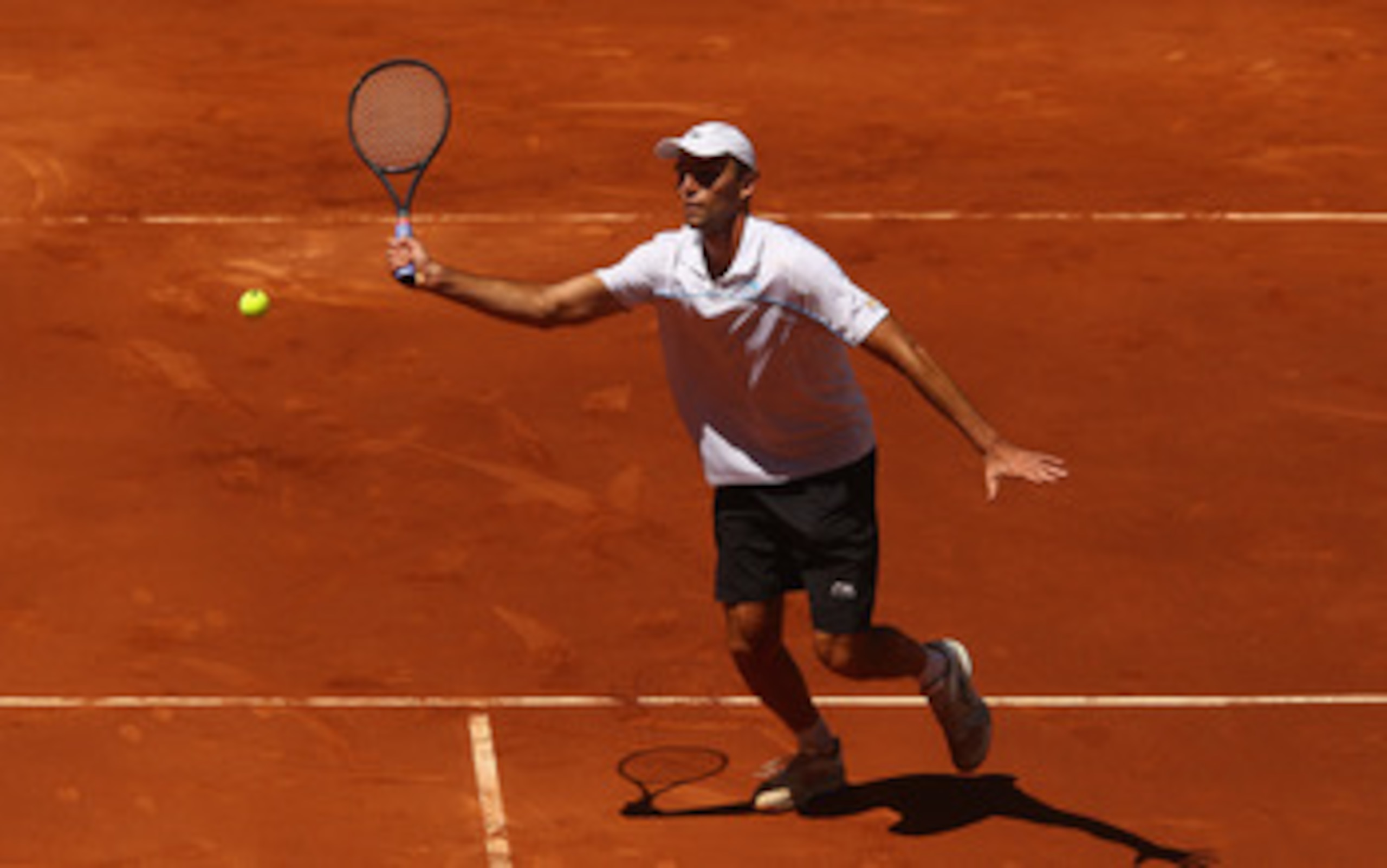 MADRID, SPAIN - MAY 02: Ivo Karlovic of Croatia plays a volley in his match against Gael Monfils of France during day three of the Mutua Madrilena Madrid Open Tennis on May 2, 2011 in Madrid, Spain. (Photo by Julian Finney/Getty Images) MADRID, SPAIN - MAY 02: Ivo Karlovic of Croatia plays a volley in his match against Gael Monfils of France during day three of the Mutua Madrilena Madrid Open Tennis on May 2, 2011 in Madrid, Spain. (Photo by Julian Finney/Getty Images)