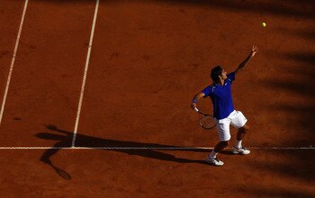 ROME, ITALY - MAY 12:  Roger Federer of Switzerland serves during his third round match against Richard Gasquet of France during day five of the Internazionali BNL d'Italia at the Foro Italico Tennis Centre on May 12, 2011 in Rome, Italy.  (Photo by Alex 