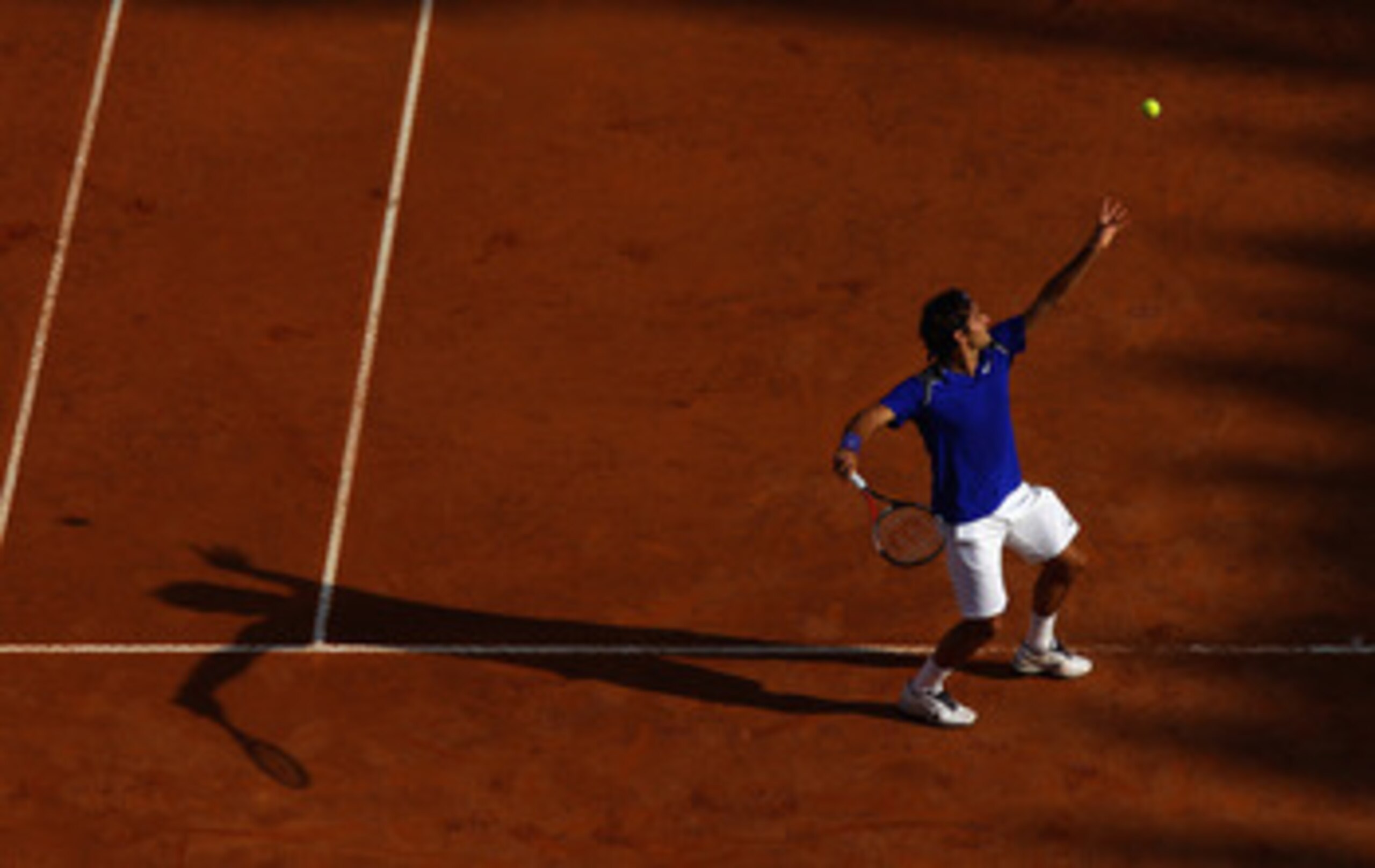 ROME, ITALY - MAY 12: Roger Federer of Switzerland serves during his third round match against Richard Gasquet of France during day five of the Internazionali BNL d'Italia at the Foro Italico Tennis Centre on May 12, 2011 in Rome, Italy. (Photo by Alex ROME, ITALY - MAY 12: Roger Federer of Switzerland serves during his third round match against Richard Gasquet of France during day five of the Internazionali BNL d'Italia at the Foro Italico Tennis Centre on May 12, 2011 in Rome, Italy. (Photo by Alex