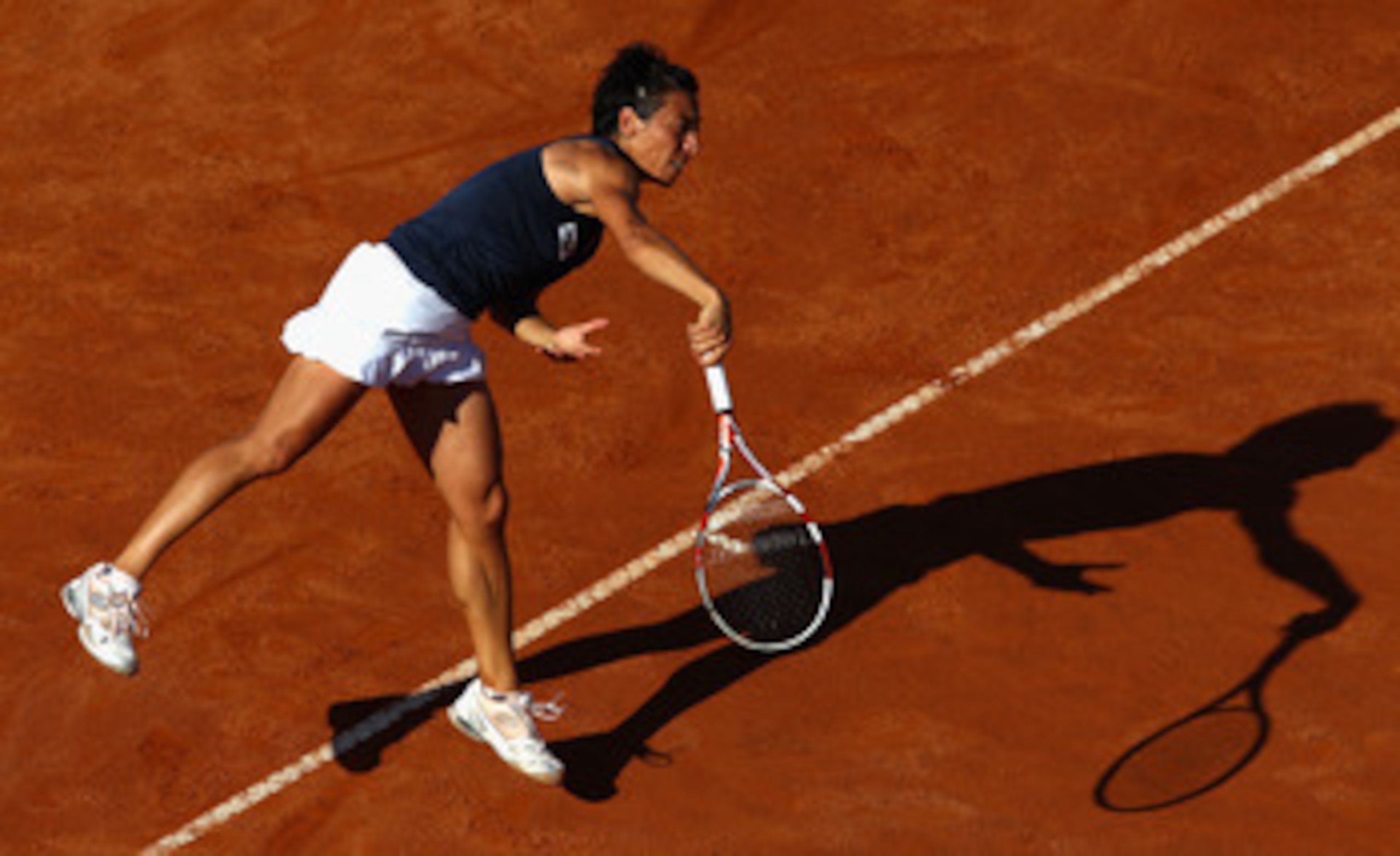 ROME, ITALY - MAY 13: Francesca Schiavone of Italy serves during her quarter final match against Samantha Stosur of Australia during day six of the Internazoinali BNL D'Italia at the Foro Italico Tennis Centre on May 13, 2011 in Rome, Italy. (Photo by ROME, ITALY - MAY 13: Francesca Schiavone of Italy serves during her quarter final match against Samantha Stosur of Australia during day six of the Internazoinali BNL D'Italia at the Foro Italico Tennis Centre on May 13, 2011 in Rome, Italy. (Photo by