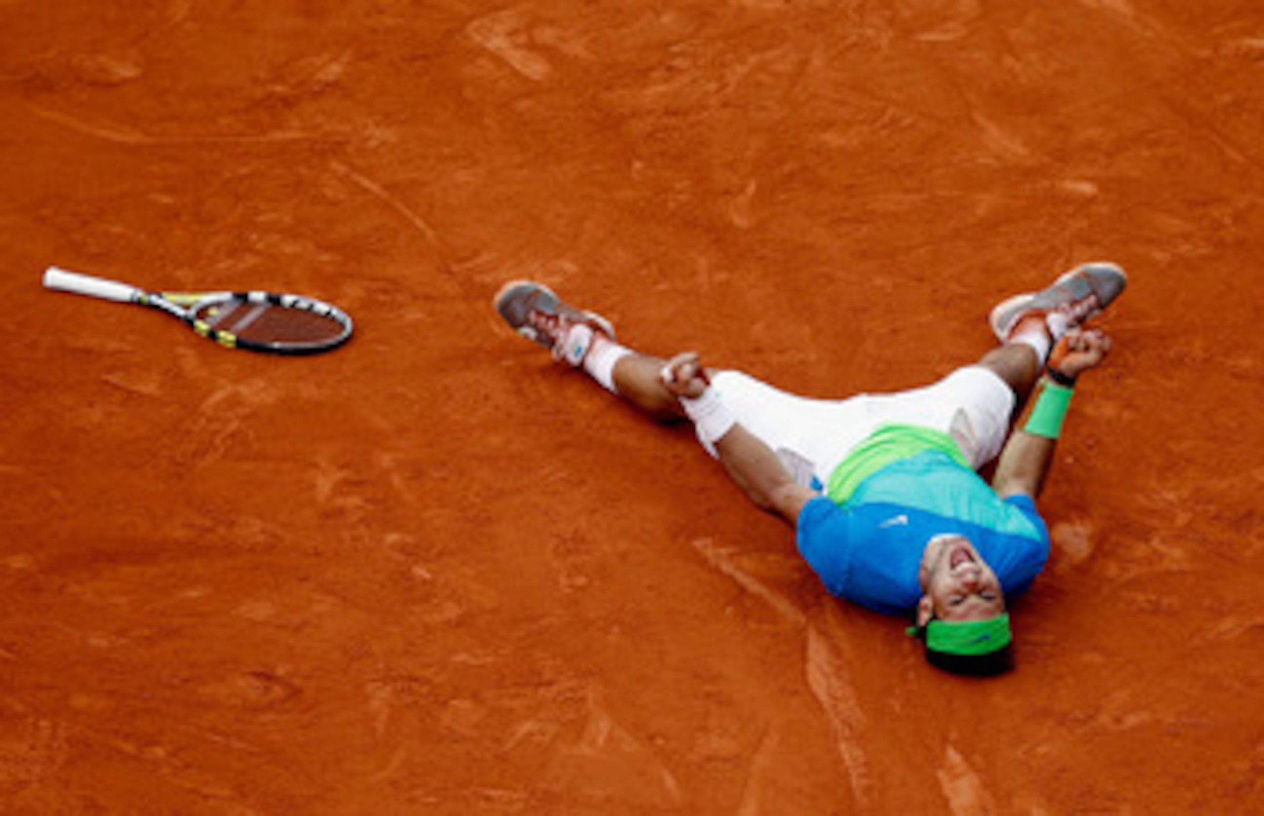 PARIS - JUNE 06:  Rafael Nadal of Spain celebrates winning championship point during the men's singles final match between Rafael Nadal of Spain and Robin Soderling of Sweden on day fifteen of the French Open at Roland Garros on June 6, 2010 in Paris, Fra