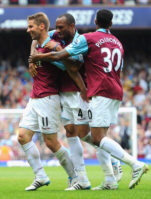 LONDON, ENGLAND - MAY 07:  Thomas Hitzlsperger of West Ham United (L) celebrates with team mates Danny Gabbidon and Frederic Piquionne after scoring the equalising goal during the Barclays Premier League match between West Ham United and Blackburn Rovers 