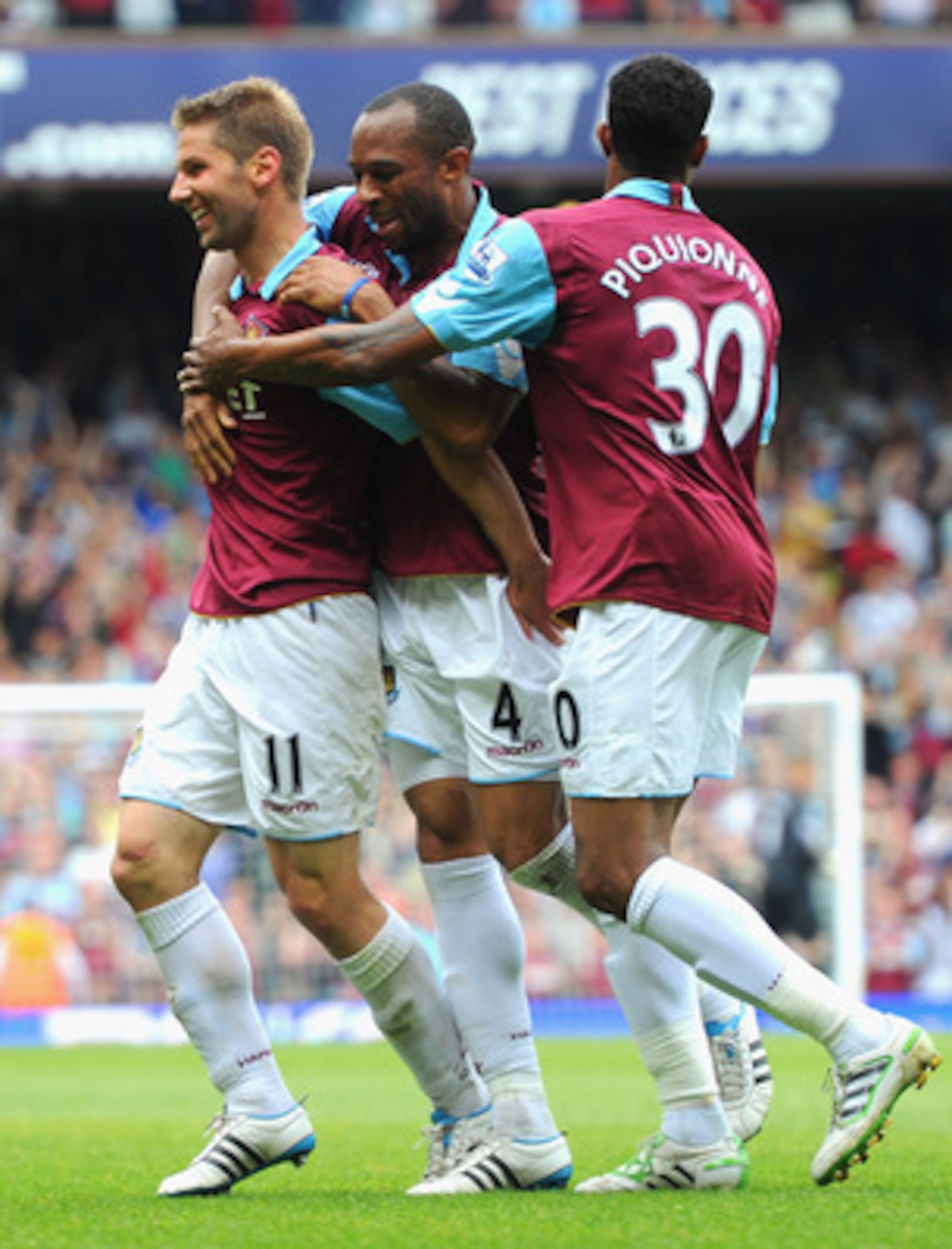 LONDON, ENGLAND - MAY 07:  Thomas Hitzlsperger of West Ham United (L) celebrates with team mates Danny Gabbidon and Frederic Piquionne after scoring the equalising goal during the Barclays Premier League match between West Ham United and Blackburn Rovers 
