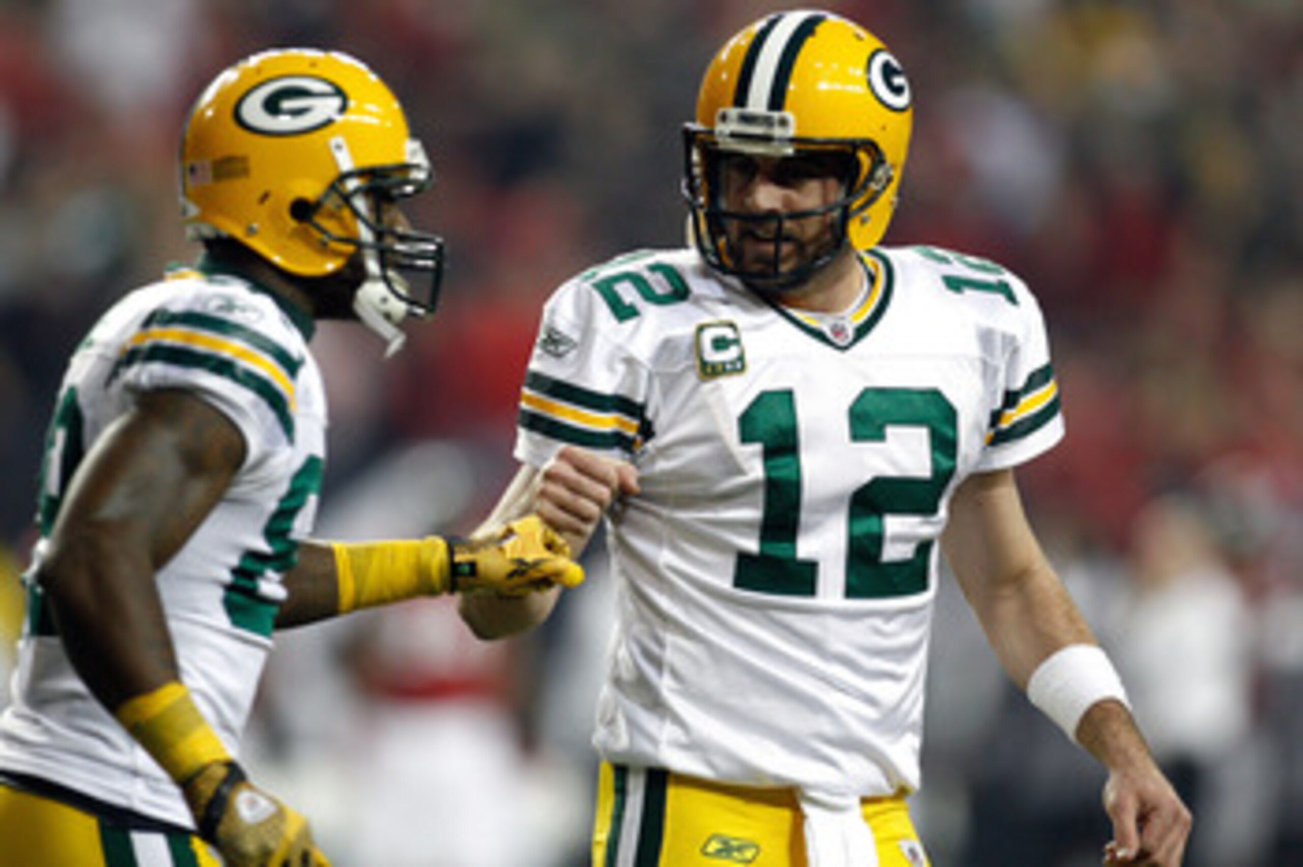 ATLANTA, GA - JANUARY 15:  Aaron Rodgers #12 and James Jones #89  of the Green Bay Packers celebrate after they connected on a 20-yard touchdown reception in the seocnd quarter against the Atlanta Falcons during their 2011 NFC divisional playoff game at G