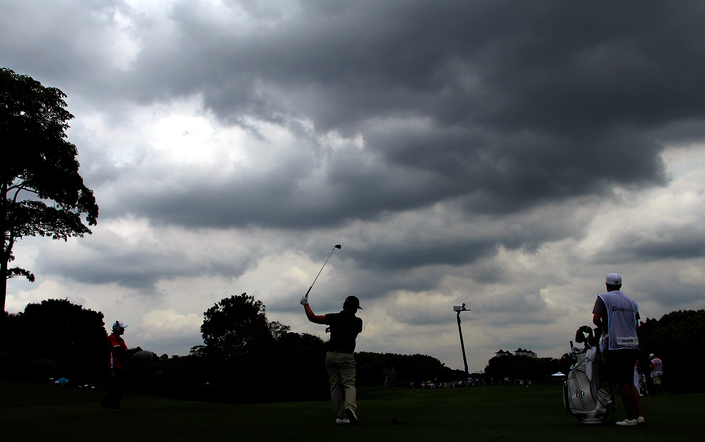 KUALA LUMPUR, MALAYSIA - OCTOBER 30: Ryan Moore of USA plays his 2nd shot on the 13th hole amiss heavy thunderstorm ahead during day three of the CIMB Asia Pacific Classic at The MINES Resort & Golf Club on October 30, 2010 in Kuala Lumpur, Malaysia. (Pho