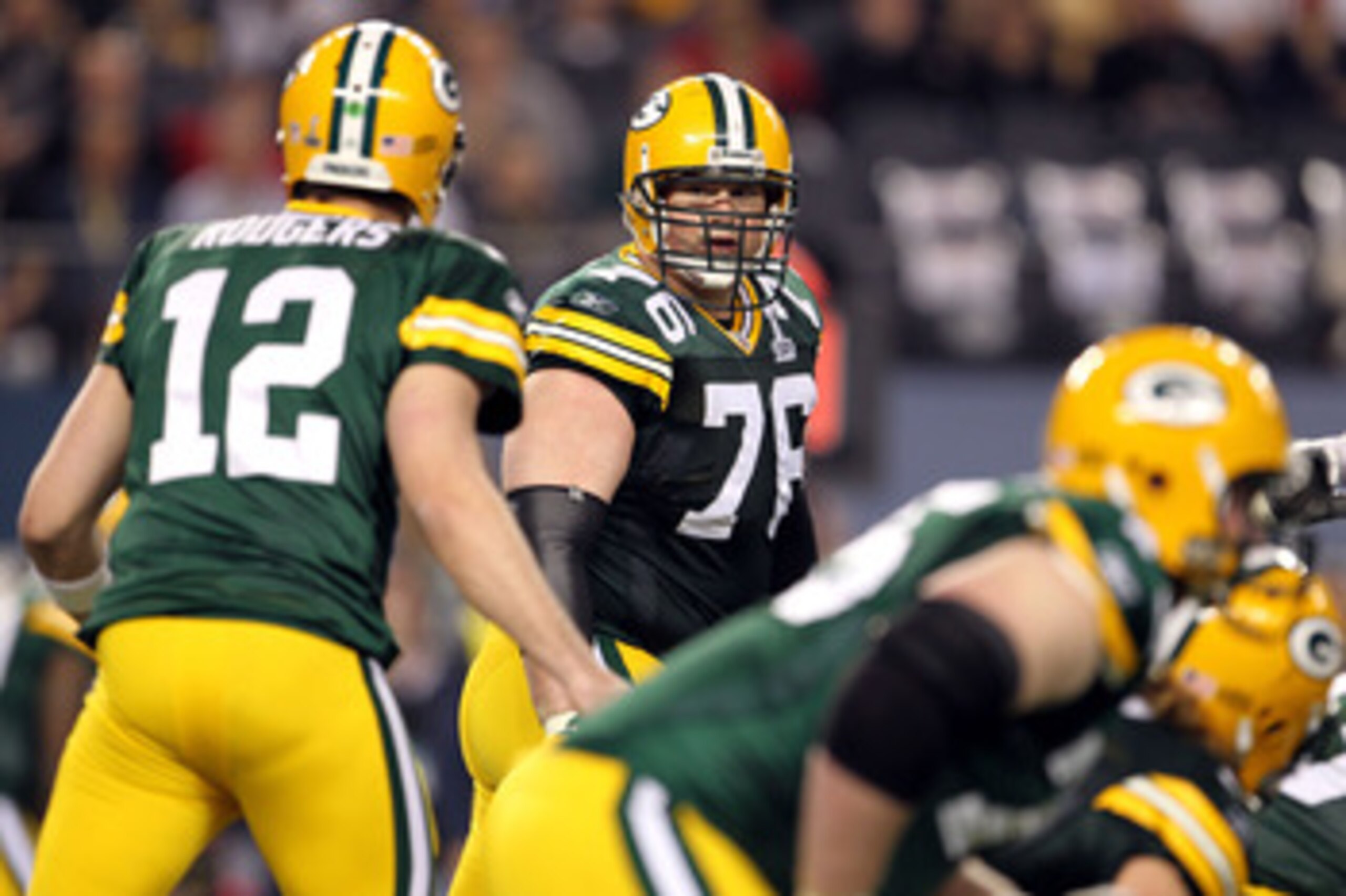 ARLINGTON, TX - FEBRUARY 06:  Chad Clifton #76 of the Green Bay Packers looks back at Aaron Rodgers #12 against the Pittsburgh Steelers during Super Bowl XLV at Cowboys Stadium on February 6, 2011 in Arlington, Texas.  (Photo by Jamie Squire/Getty Images)