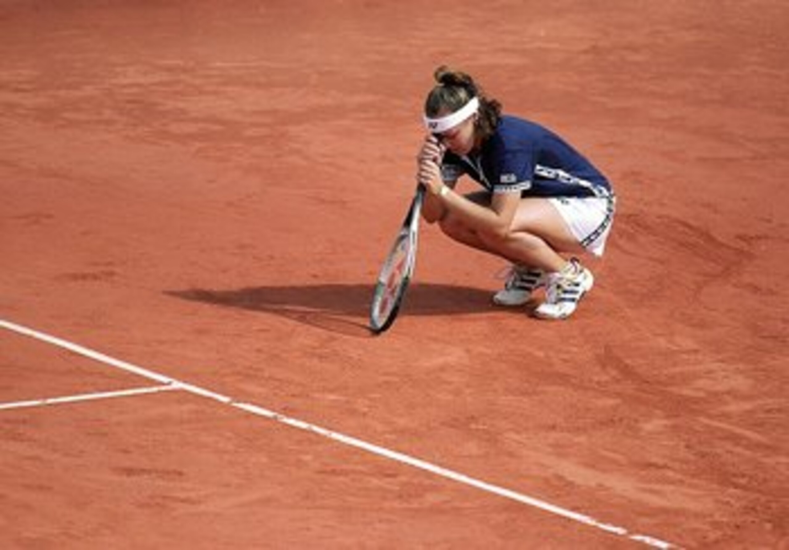 5 Jun 1999: Martina Hingis of Switzerland looks dejected as she leans her head on her racket after losing the second set in her women's final match to Steffi Graf of Germany in the women's singles final of the French Open at Roland Garros in Paris.